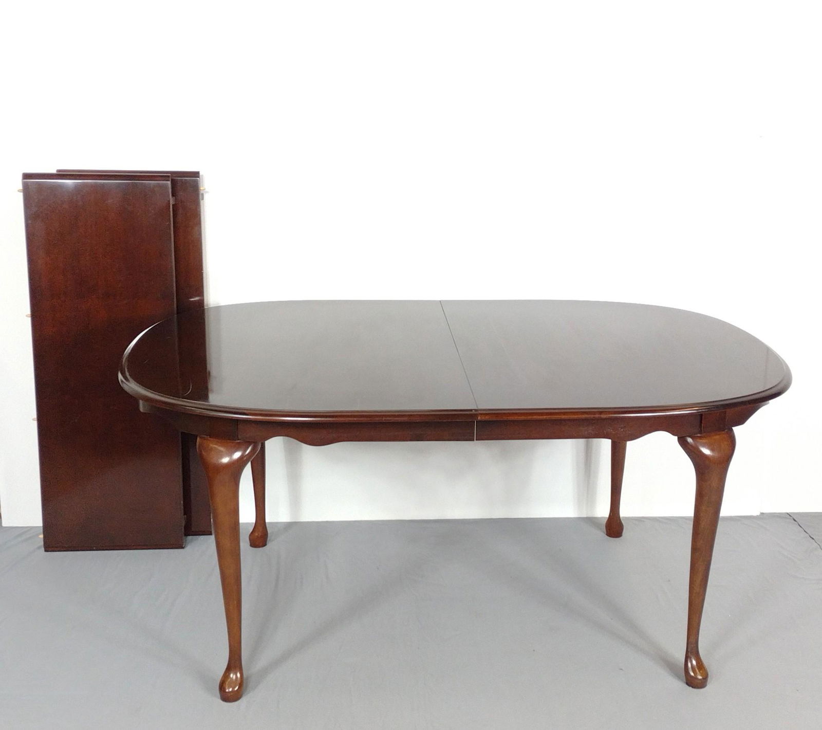 Dining Room Table With Two Leaves: Table 66" wide X 44" deep X 29-1/4" high. Leaves 16" wide. Table top has some light scratches. MG. IMPORTANT: Before bidding, please read the terms and conditions. When you registered for the auction