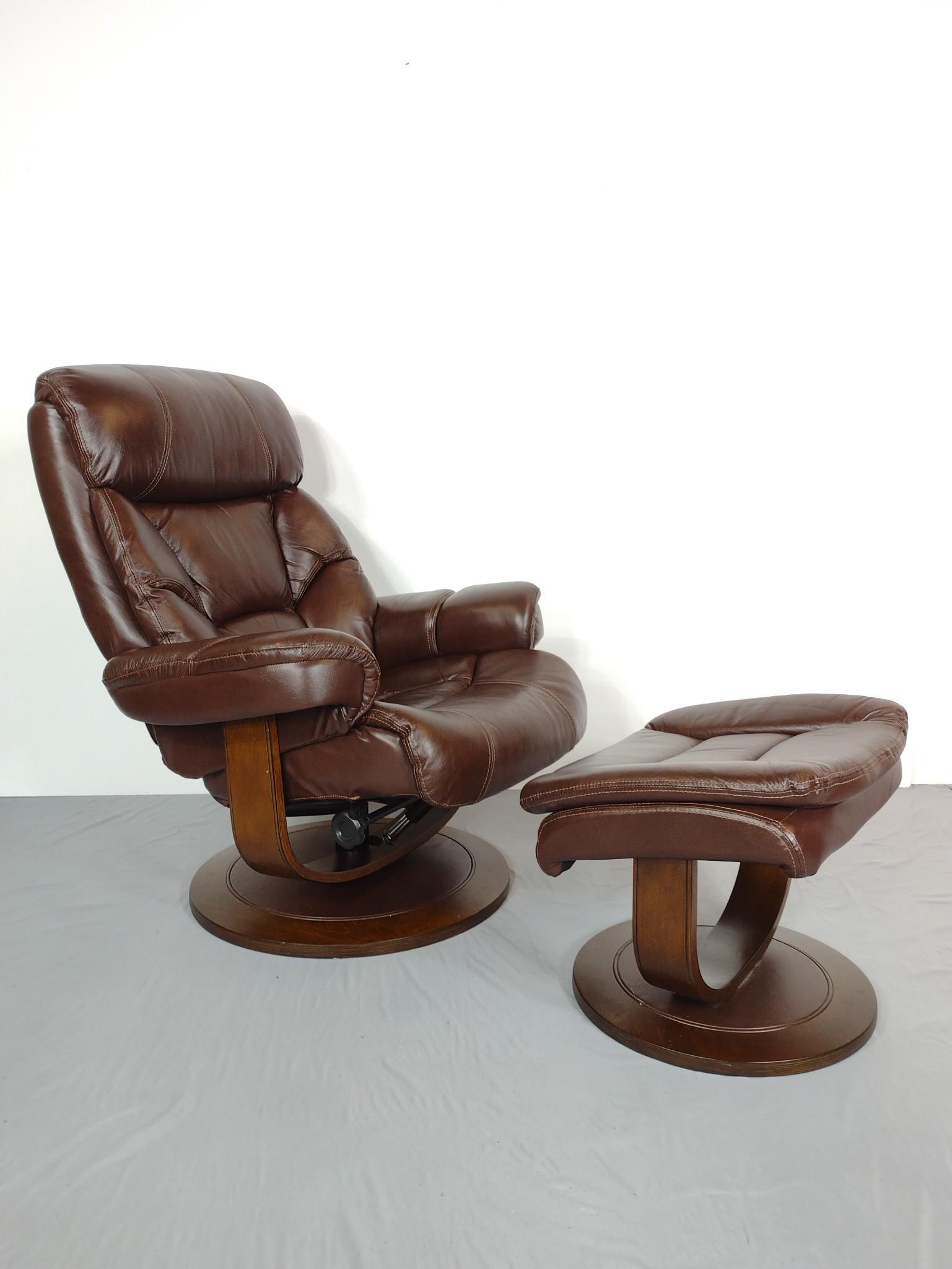 Leather Recliner With Ottoman: Made by Man Wah Furniture Co. Chair: 33" wide X 31" deep X 40-1/2" high. Ottoman 22" wide x18" deep X 18" high. MG. IMPORTANT: Before bidding, please read the terms and conditions. When you registered