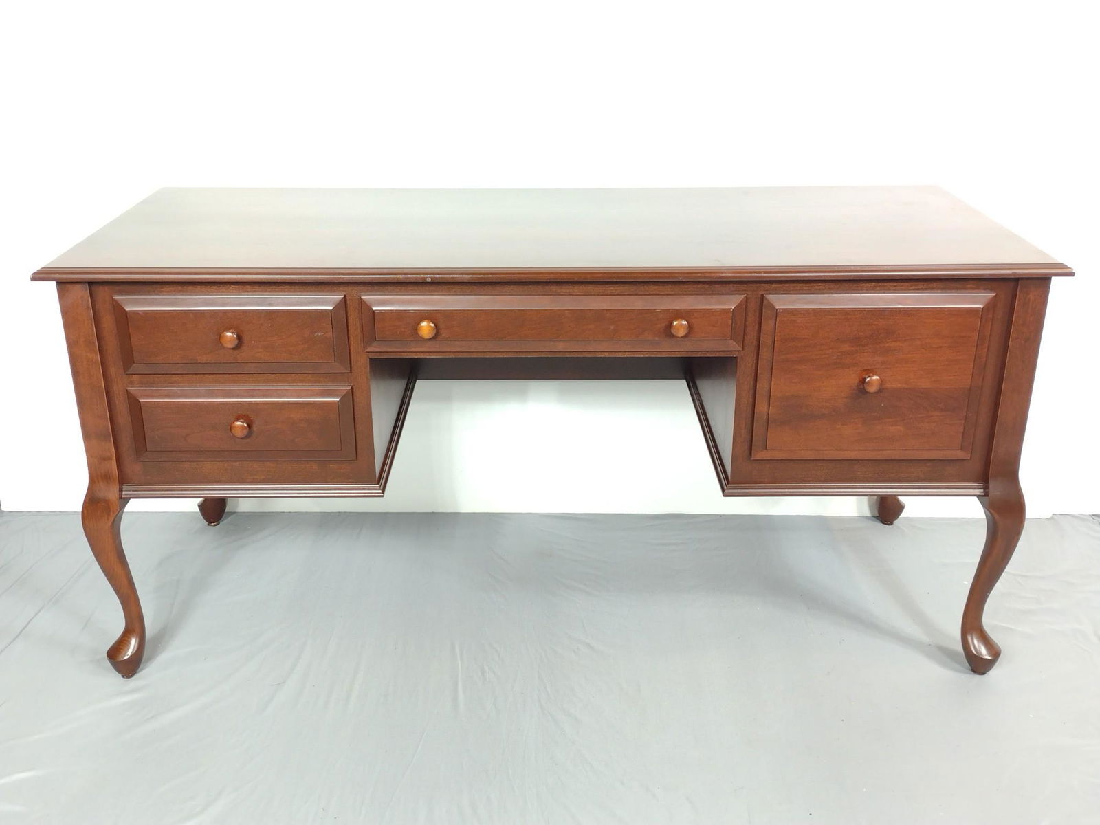 Executive Desk: 64" wide X 25-1/2" deep X 30-1/2" high. Has a few light scratches. No makers markings. MG. IMPORTANT: Before bidding, please read the terms and conditions. When you registered for the auction you agre
