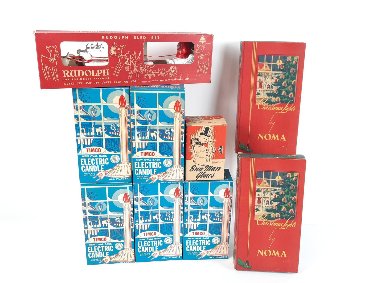 9 Vintage Christmas Lights and Rudolph Sled Set: All with original box. Sled: 15" long. Includes one extra Rudolph. LR IMPORTANT: Before bidding, please read the terms and conditions. When you registered for the auction you agreed to these terms and