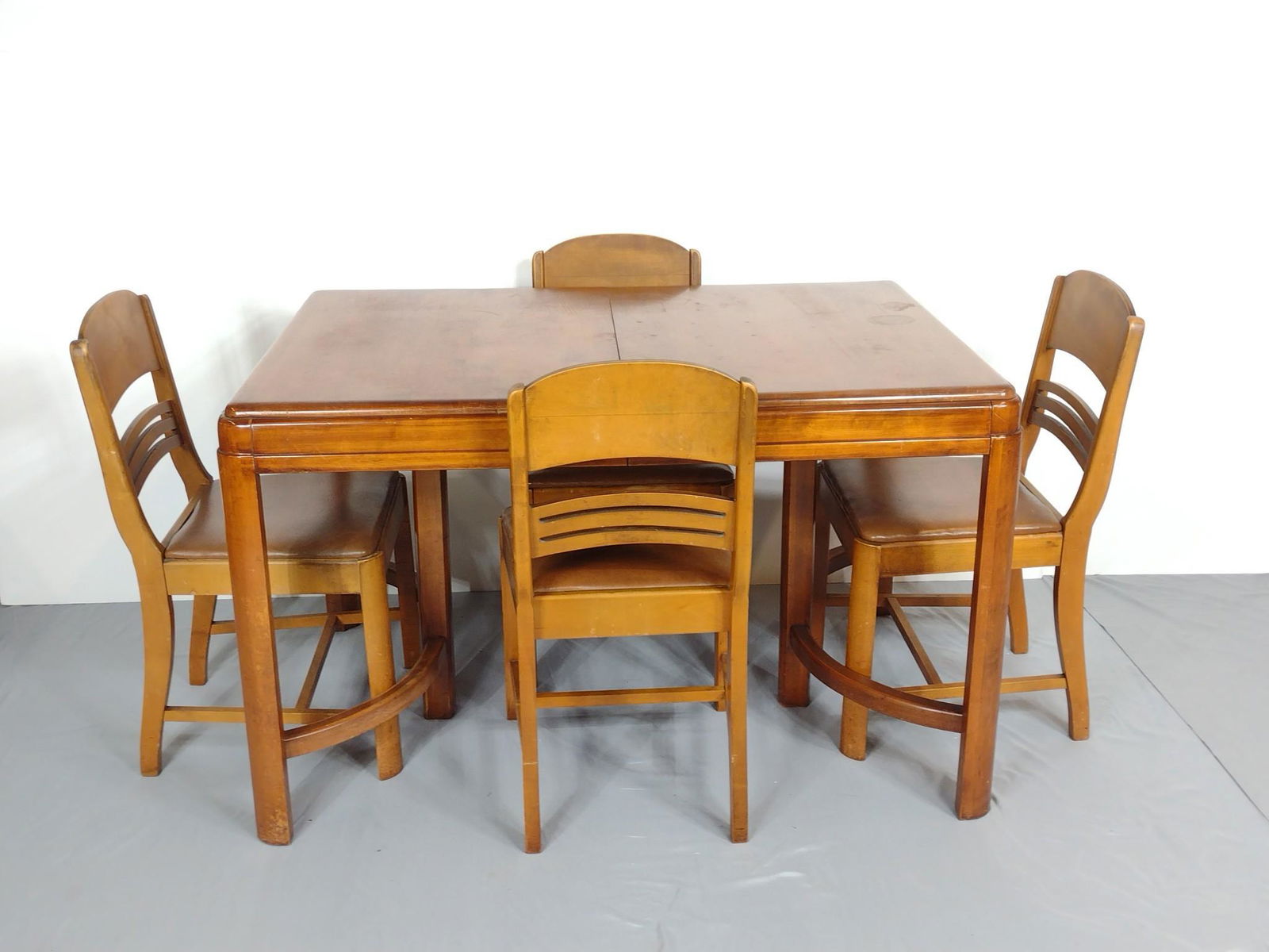 Peerless Table And Chair Set: Table 49" wide X 33" deep X 30-1/2" high. Chairs 17" wide X 16-1/2" deep X 33-1/4" high. All Pcs have some scratches and finish loss. MG. IMPORTANT: Before bidding, please read the terms and condition