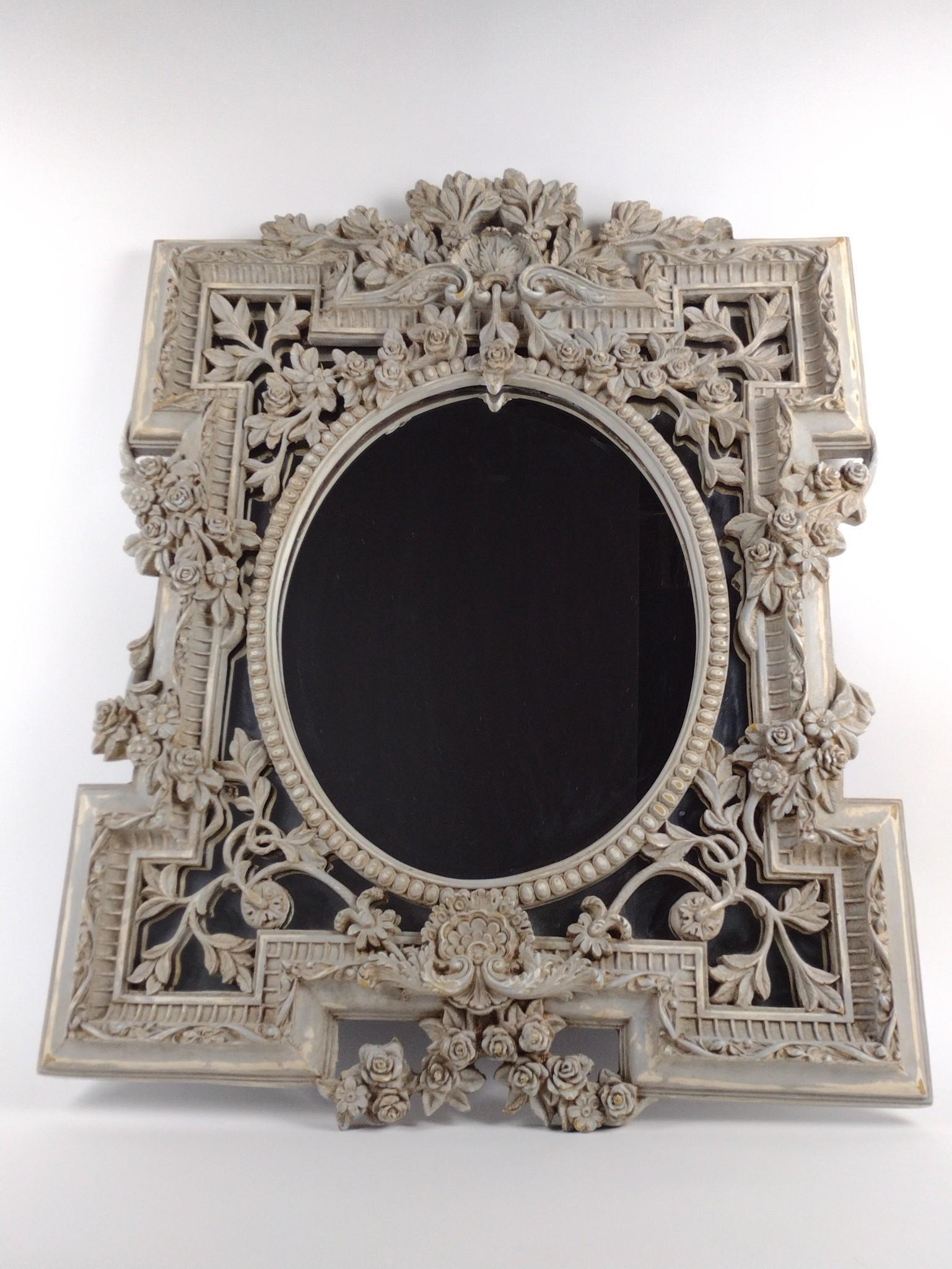 Ornate Mirror: Plaster over wood. Overall with frame 36" high x 28-1/2" wide. Some surface losses. DP. IMPORTANT: Before bidding, please read the terms and conditions. When you registered for the auction you agreed 
