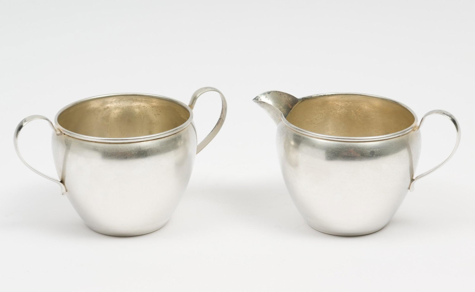 Preisner Sterling Cream and Sugar: Each marked Preisner Sterling and 767. Each 2-2/3" high to rim. 4.3 ozt total. Creamer with ding; see image. MH. IMPORTANT: Before bidding, please read the terms and conditions. When you registered fo
