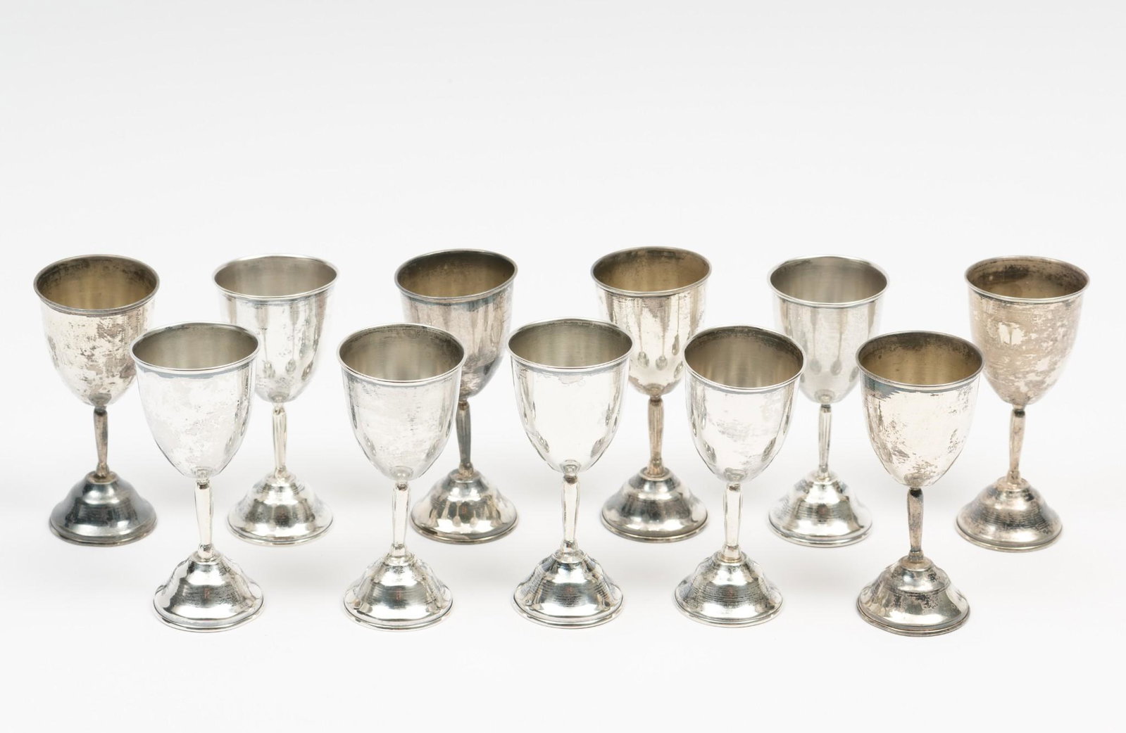 11 Taxco Sterling Cordials: Each marked Taxco Sterling 925 CN. Each 3-1/3" high. 6.1 ozt total. MH. IMPORTANT: Before bidding, please read the terms and conditions. When you registered for the auction you agreed to these terms a
