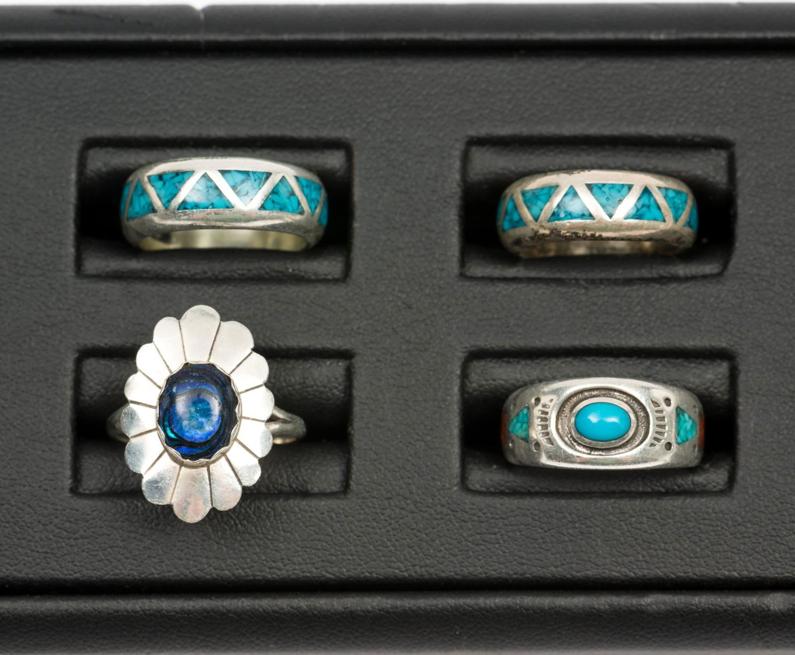 4 Nat Amer Sterling Rings incl Turquoise & Abalone: Three bands marked sterling. Band with cabochon signed with horse head. Bands with triangles signed SO in cloud. 1/4" to 3/4" wide. Sizes 4 to 6.5. MH. IMPORTANT: Before bidding, please read the terms
