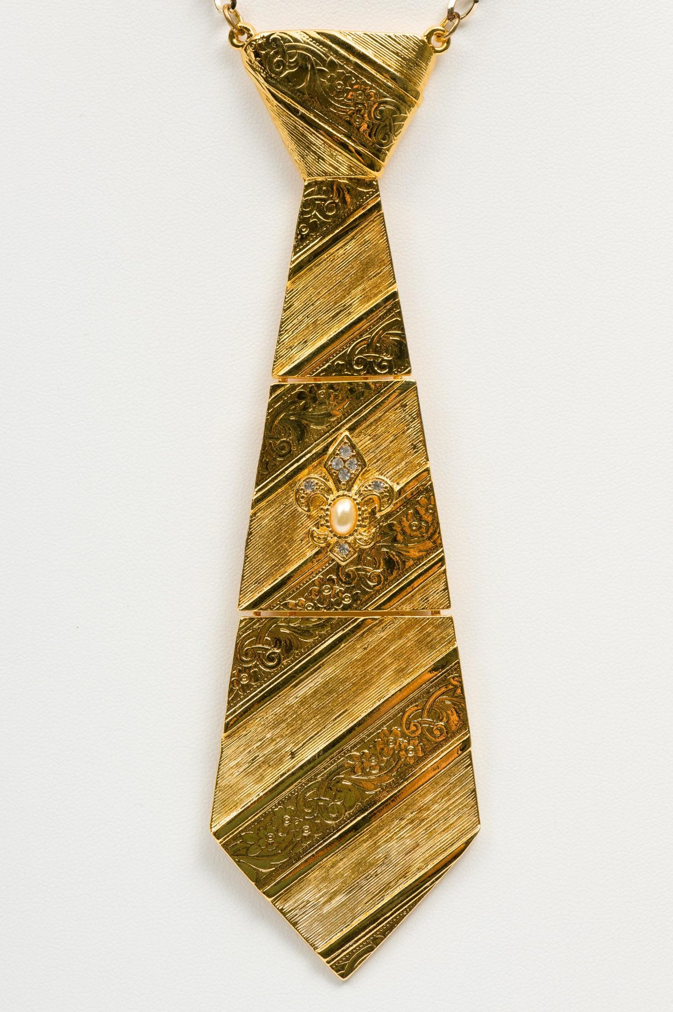 Jonette Jewelry Necktie Necklace: 6" long tie on 16" necklace. MH. IMPORTANT: Before bidding, please read the terms and conditions. When you registered for the auction you agreed to these terms and will be required to comply with them