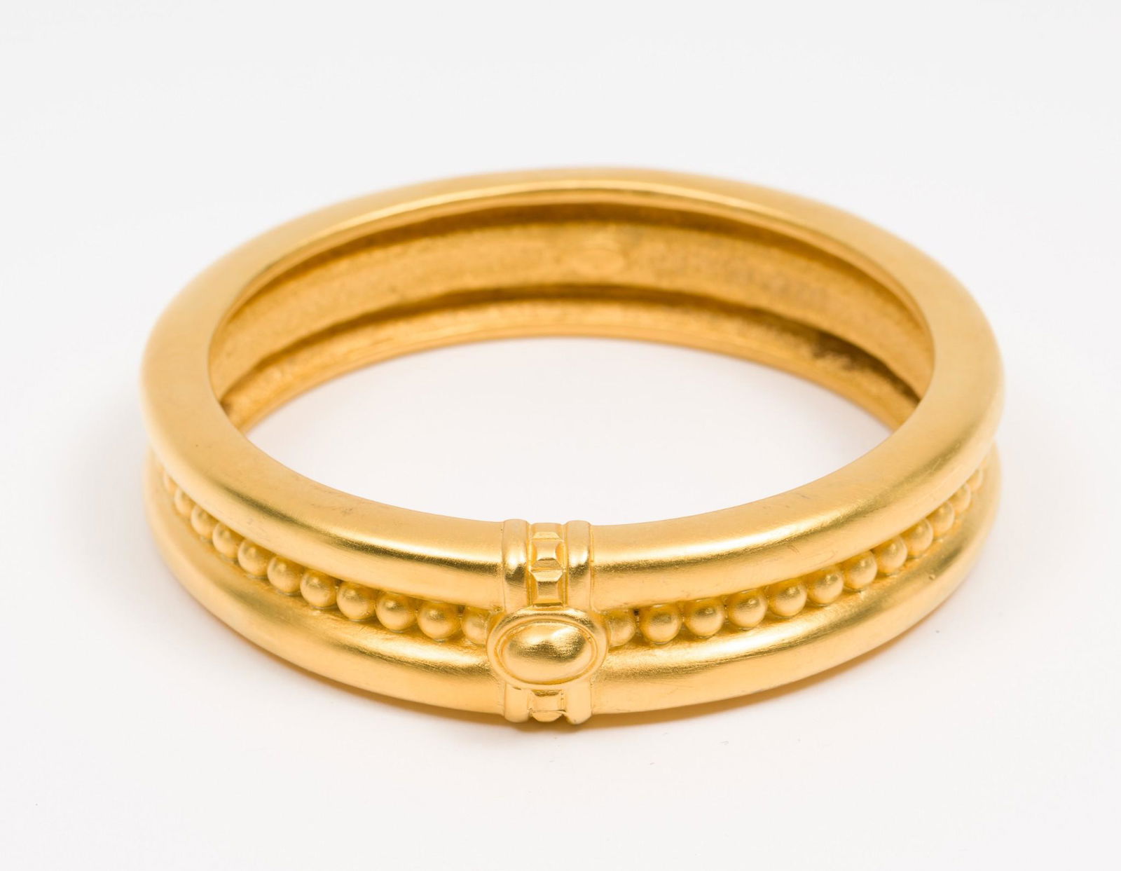 Givenchy Etruscan Revival Bangle: 2/3" wide x 3" diameter. MH. IMPORTANT: Before bidding, please read the terms and conditions. When you registered for the auction you agreed to these terms and will be required to comply with them.