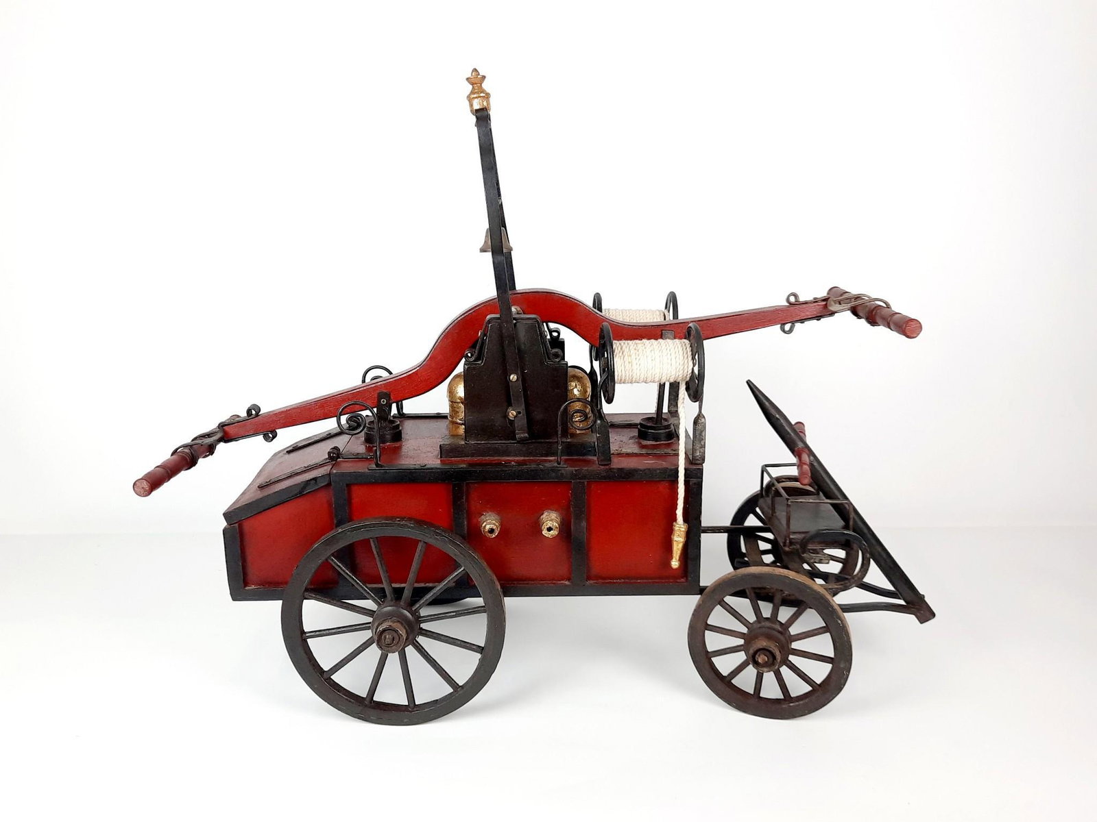 24" Wooden Fire Pumper Toy: No manufacturers markings. 30" wide x 13" deep x 24" high. LR The item(s) in this lot are being sold from the Estate of Stephen Reed. IMPORTANT: Before bidding, please read the terms and conditions. W