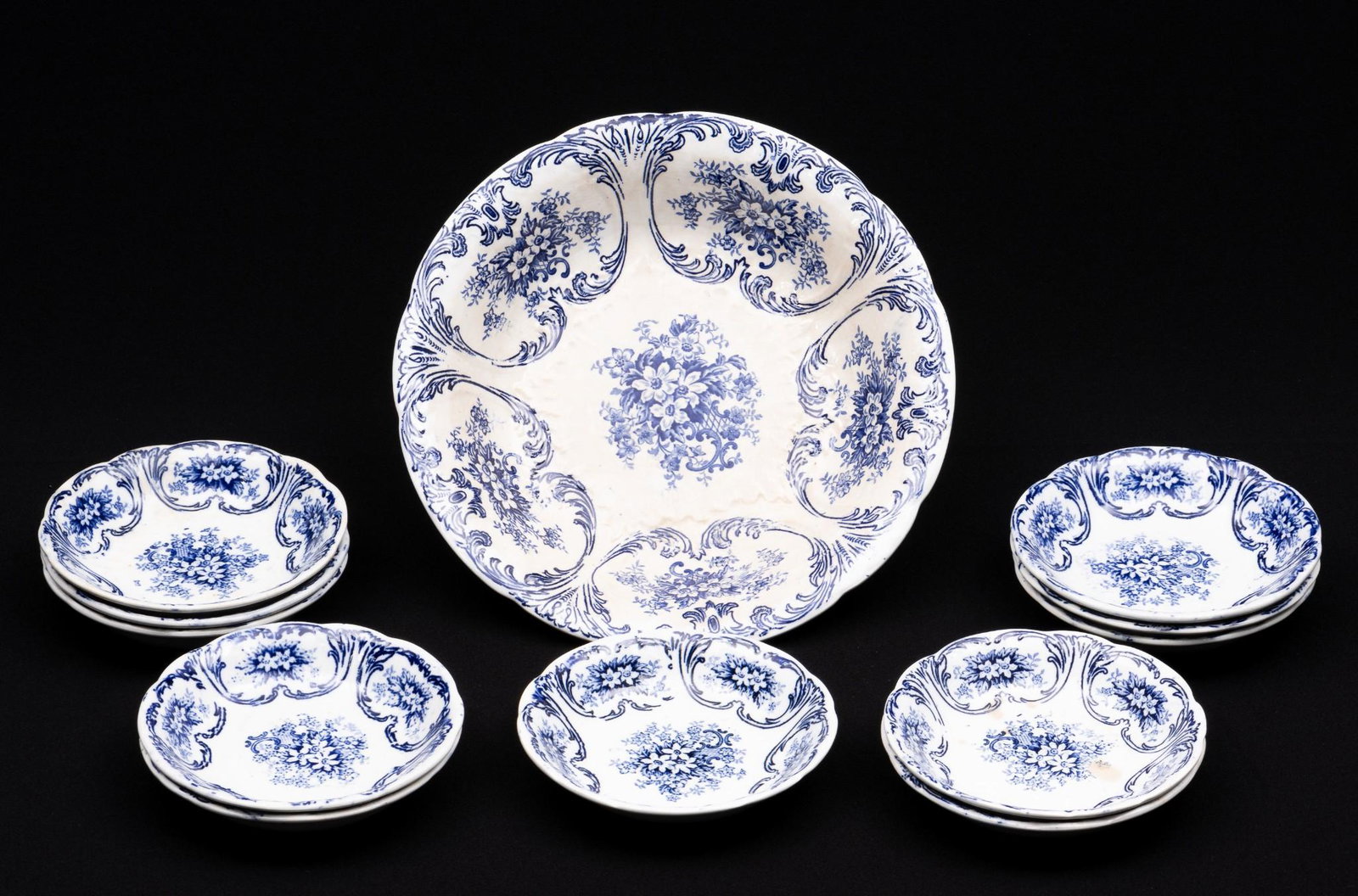 12 Meissen Blue and White Bowls: Twelve Meissen blue and white bowls. Pattern MSS140. Includes eleven sauce bowls and one serving bowl. All stamped to back with Meissen Germany castle stamp Mehlem Bonn. 5-3/8" diameter to 9-3/4" diam