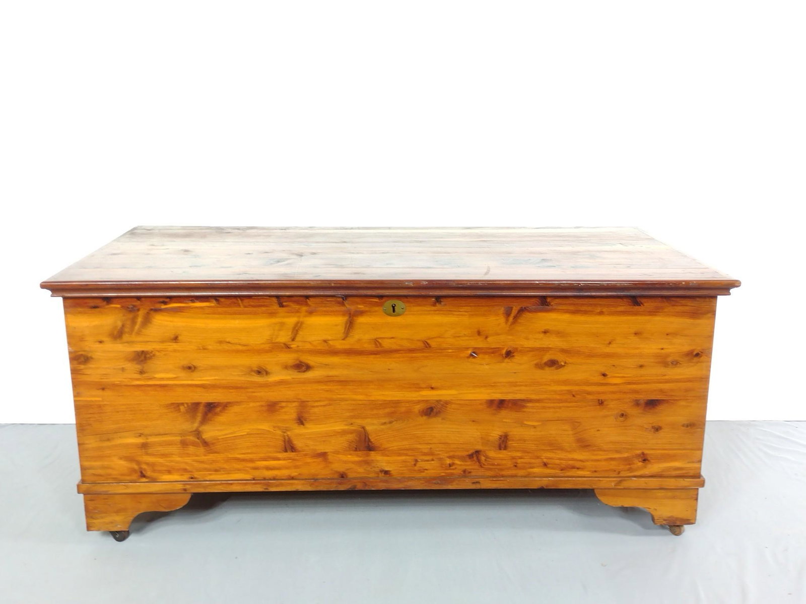 Cedar Chest: 46" wide X 22" deep X 19-3/4" high. Has some like scratches. MG. IMPORTANT: Before bidding, please read the terms and conditions. When you registered for the auction you agreed to these terms and will
