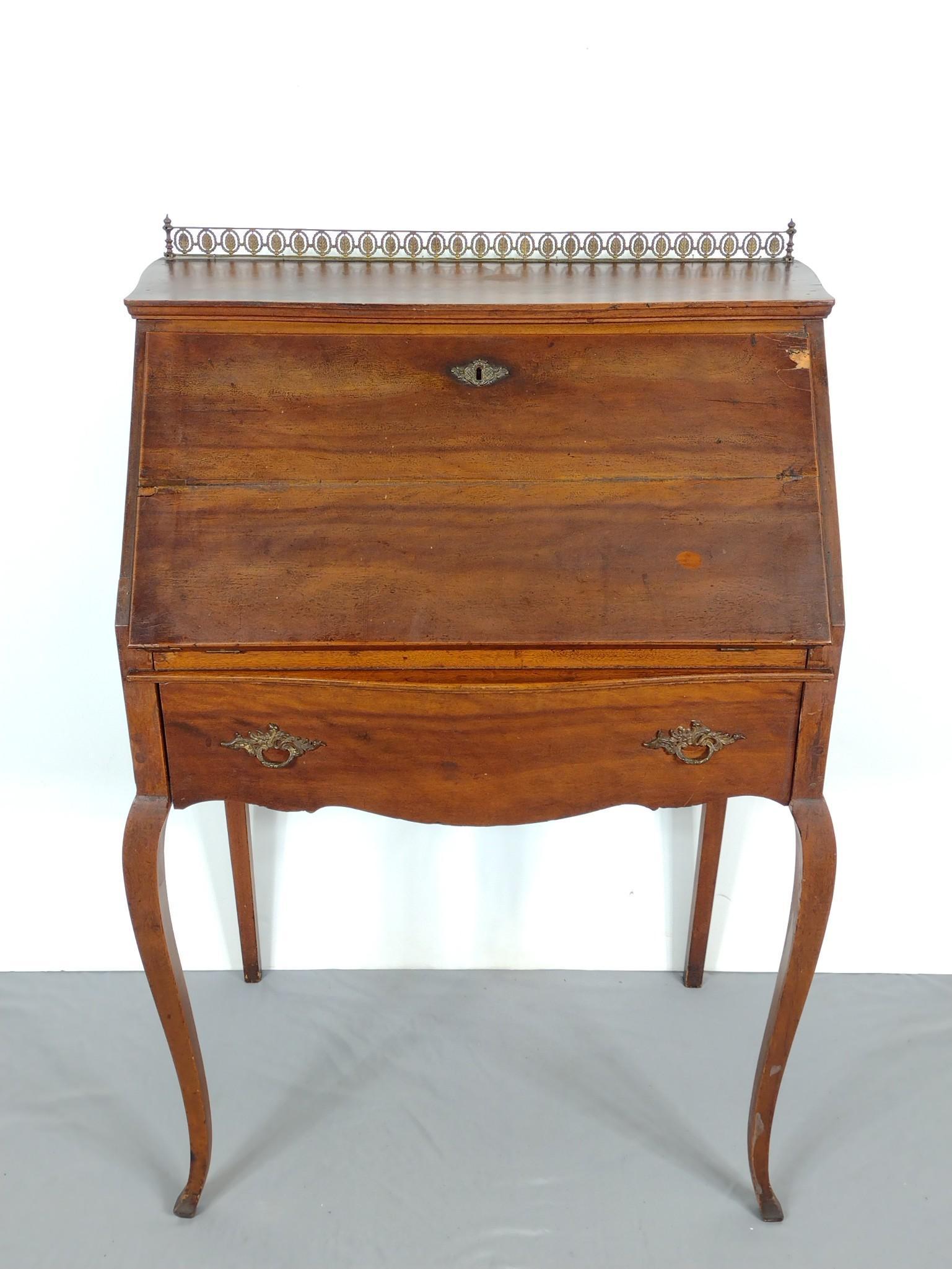 Ladies Writing Desk: 28-1/4" wide X 17" deep X 42" high. Has veneer loss to desk front. Has some scratches. MG. IMPORTANT: Before bidding, please read the terms and conditions. When you registered for the auction you agre
