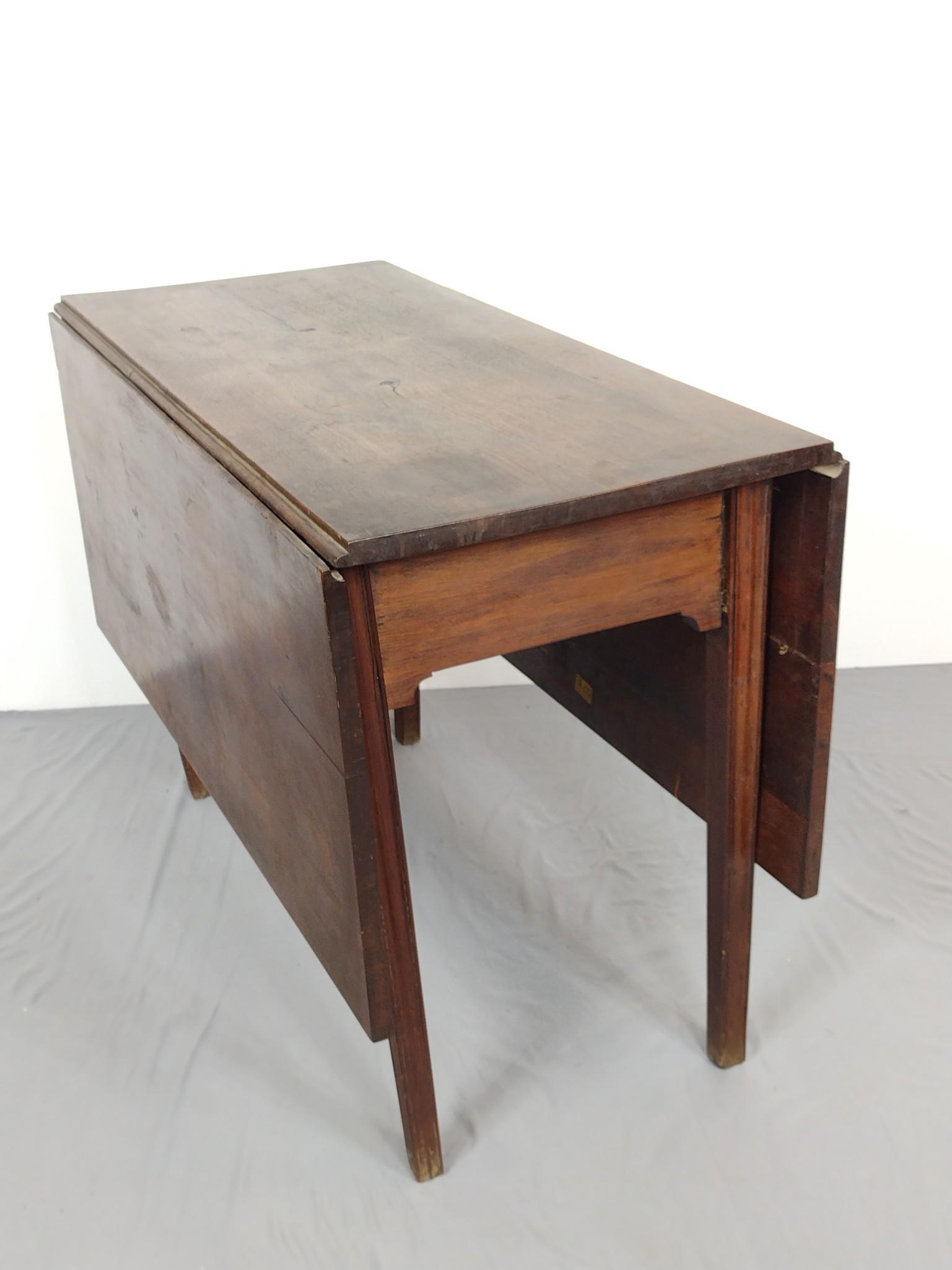 Drop Leaf Table: Open 54", closed 19-3/4" wide X 42" deep X 29" high. Has some scratches. Top has some discoloring. MG. IMPORTANT: Before bidding, please read the terms and conditions. When you registered for the auct