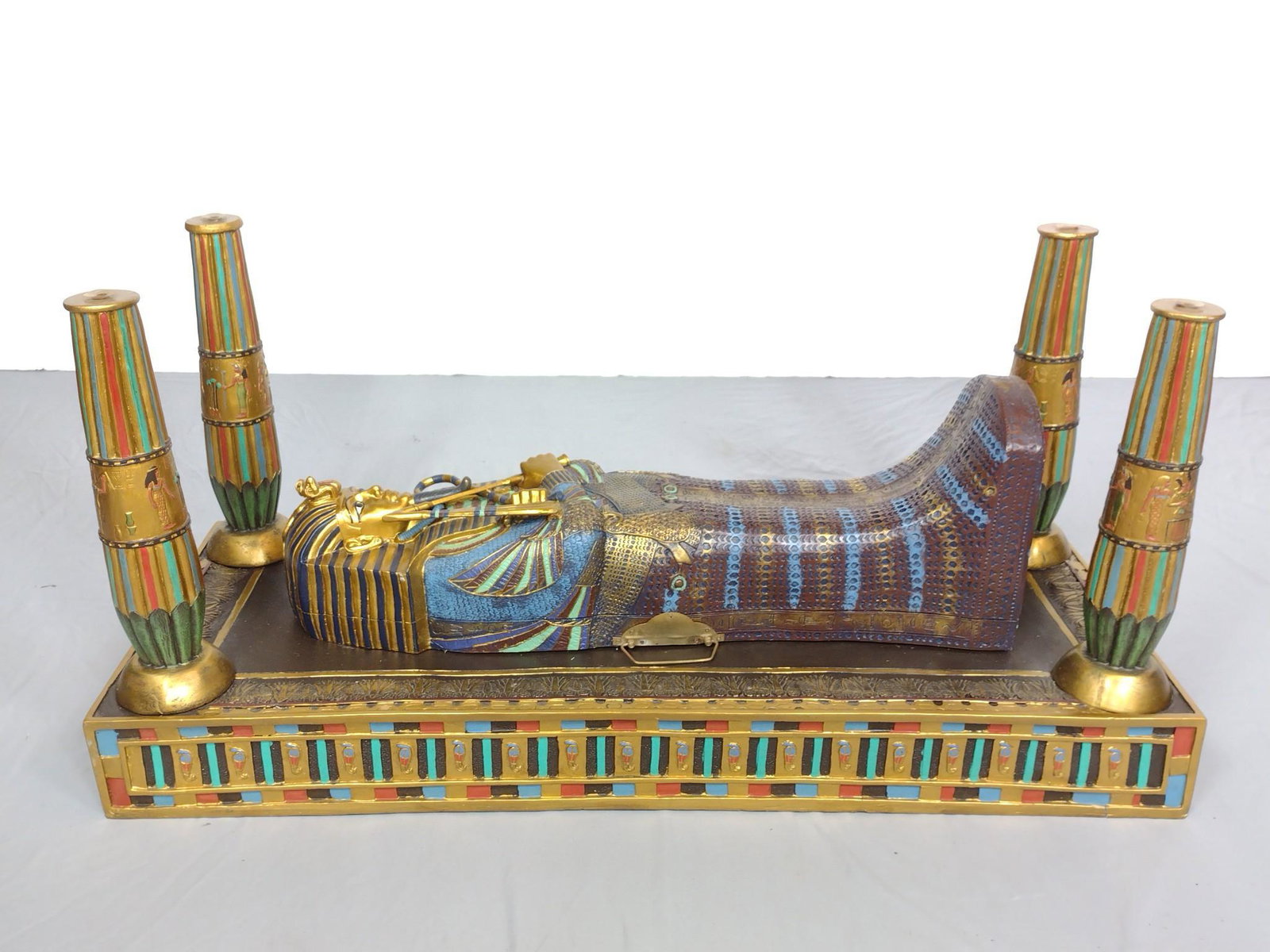 Sarcophagus Form Table: Missing glass top. 37" wide X 14-3/4" deep X 17-3/4" high. MG. The item(s) in this lot are being sold for the Estate of Stephen Reed. IMPORTANT: Before bidding, please read the terms and conditions. W