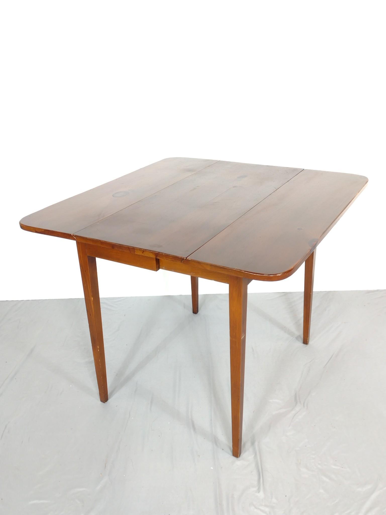 Drop Leaf Table: Open 34", closed 15-1/2" wide X 36" deep X 28-1/4" high. Has some light scratches. MG. IMPORTANT: Before bidding, please read the terms and conditions. When you registered for the auction you agreed t
