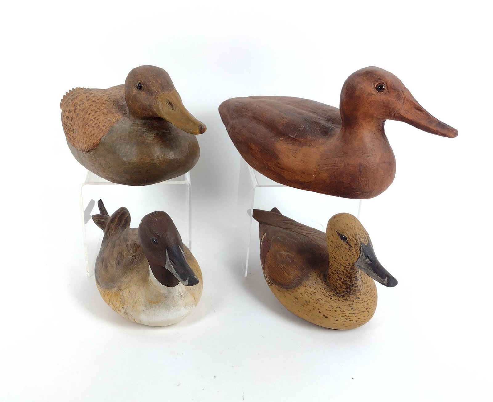 4 Duck Decoys: 11" to 15" long X 6" to 7" high. MEG IMPORTANT: Before bidding, please read the terms and conditions. When you registered for the auction you agreed to these terms and will be required to comply with 