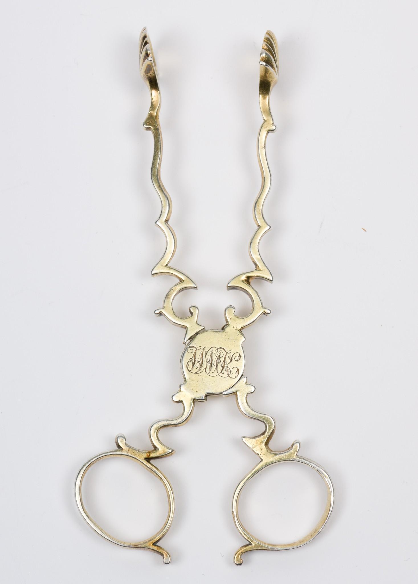 Gold Washed British Sterling Sugar Tongs: Marked with British lion passant certifying sterling and unidentified "IP" makers mark. Monogrammed. 5" long. 1.2 ozt. RM IMPORTANT: Before bidding, please read the terms and conditions. When you regi