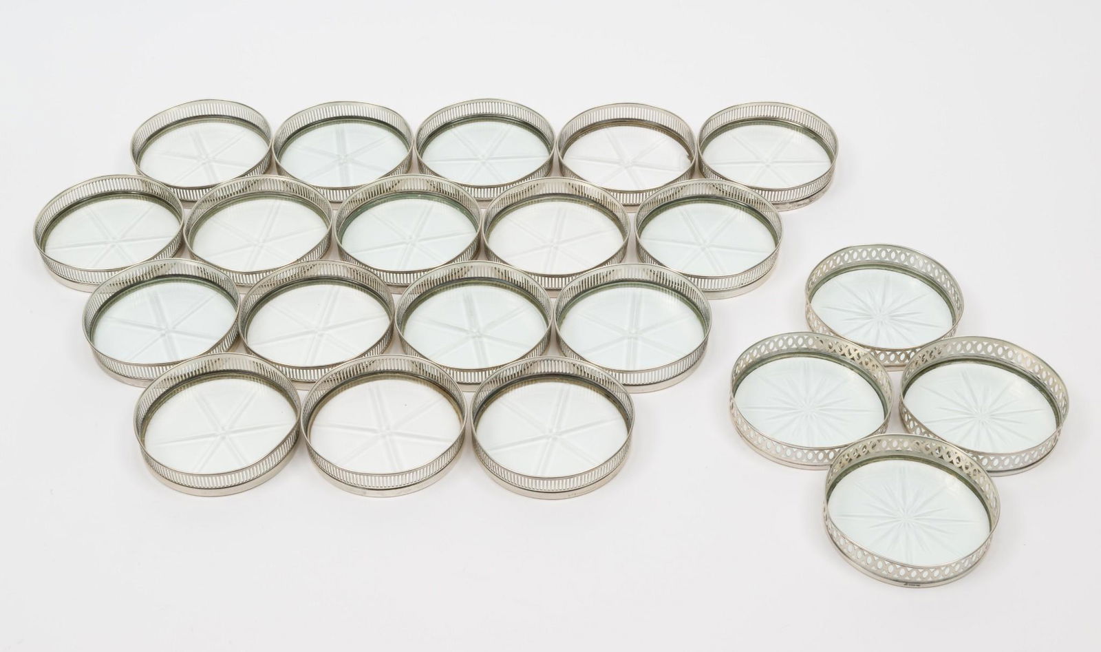21 Sterling & Glass Coasters: Seventeen marked for Frank M. Whiting Co., five with chipped glass. Four with JE unidentified makers mark. Some with bends in rims. 3" diameter. RM IMPORTANT: Before bidding, please read the terms and