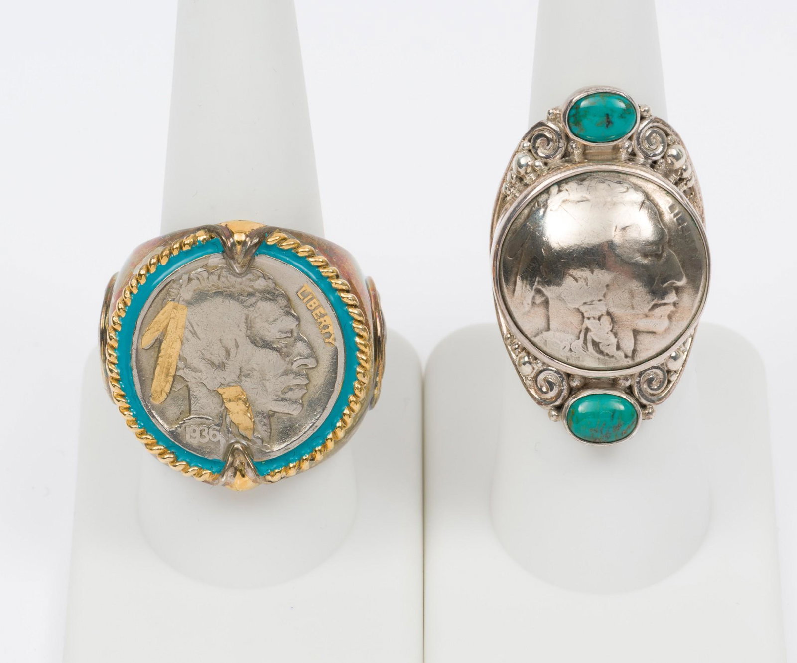 2 Buffalo Nickel Sterling Rings: One ring with turquoise stones, marked 925 and Sajan to back. Second ring with gilt accents, marked 935 BGE and Indian Head Nickel Honoring the American West to interior of shank. Sizes 6.25 and 9. RM