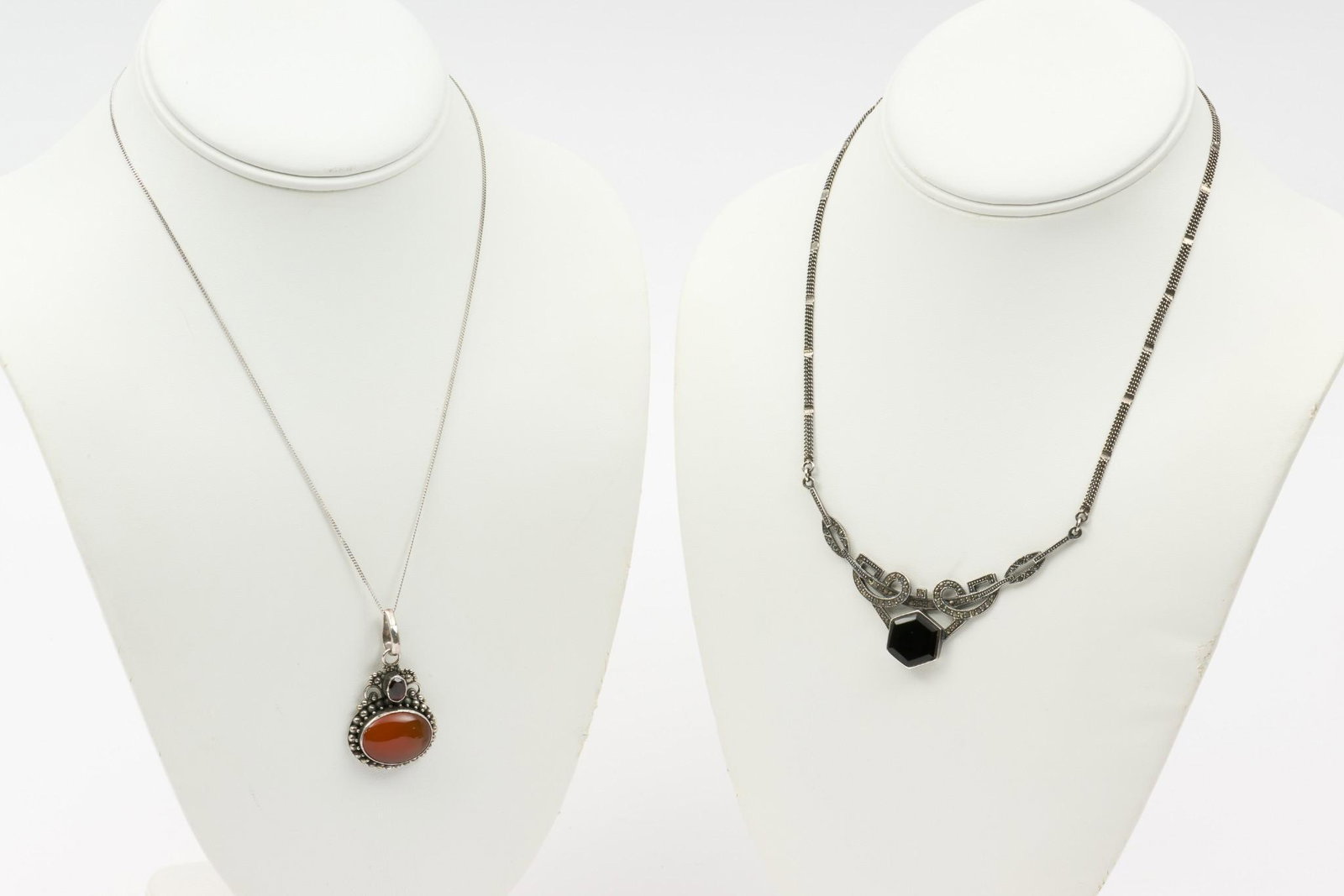 2 Sterling & Hardstone Necklaces: Carnelian and garnet necklace 17-3/4" long with 2-1/4" pendant. Onyx and marcasite necklace 14" long. IMPORTANT: Before bidding, please read the terms and conditions. When you registered for the aucti