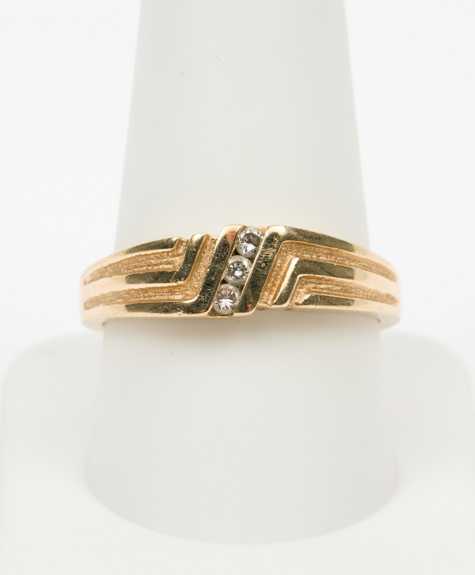 14K Gold & Diamond Ring: Stamped 14k gold setting with three .03 carat each channel set round brilliant cut diamonds. Clarity I1, Color H-I. 3.4 dwt. Size 10.5. EK IMPORTANT: Before bidding, please read the terms and conditio