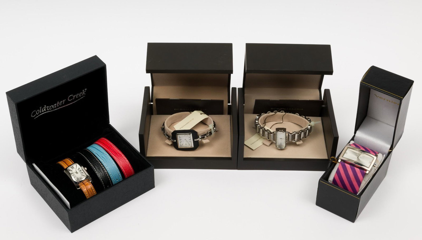 4 Ladies Fashion Wristwatches incl BCBG: 2 BCBG Max Azaria, one Coldwater Creek with interchangeable bands, one Vernier. All with quartz movements. Each appears unworn in original box. 1/2" to 1-1/3" lug to lug. MH. IMPORTANT: Before bidding