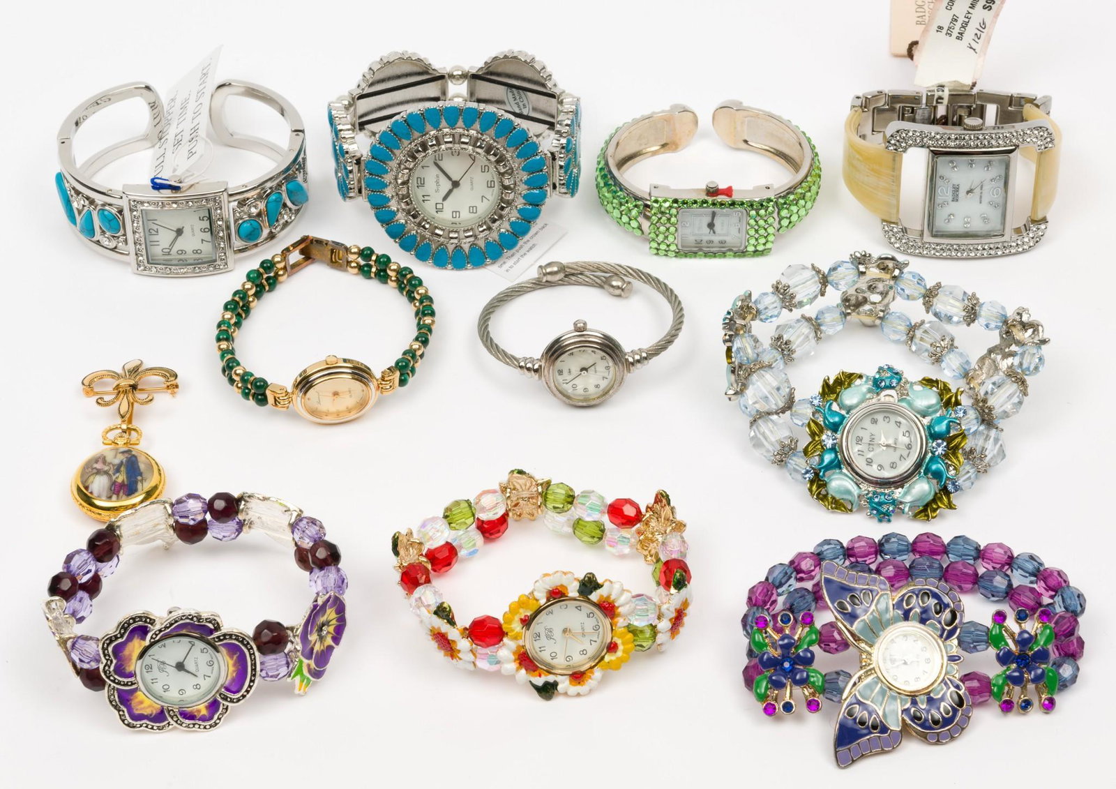 11 Ladies Fashion Wristwatches and 1 Brooch Watch: Includes Camalier & Buckley, Sophie, CTNY, Bagdley Mishka, and Lucoral. Each unworn. 3/4" to 2" lug to lug. MH. IMPORTANT: Before bidding, please read the terms and conditions. When you registered for