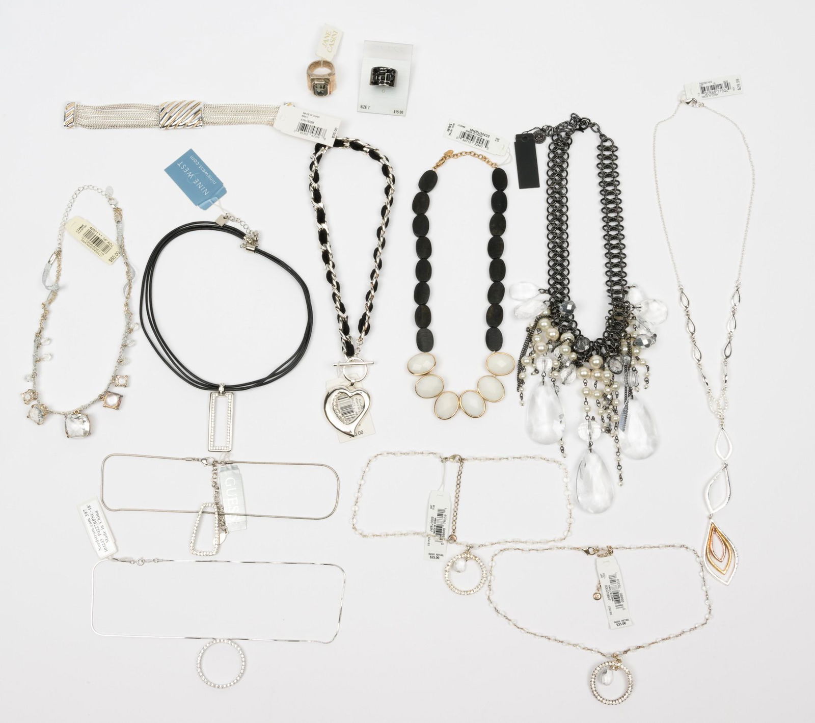 10 Costume Necklaces, 1 Bracelet, and 3 Rings: Includes Nine West, Napier, Guess, Liz Claiborne, Margeaux, Nadri, and 1828. Necklaces 16" to 18" long. Rings sizes 7 and 8. bracelet 7" long. MH. IMPORTANT: Before bidding, please read the terms and