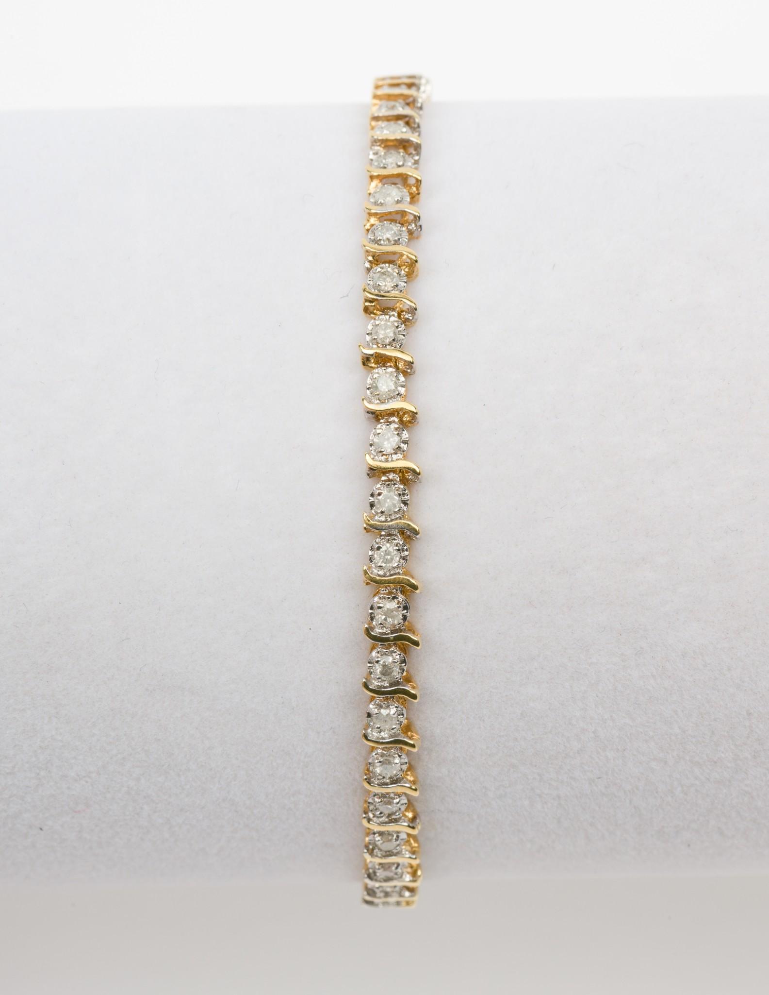 10K Gold & .92 CTW Diamond Tennis Bracelet: Stamped 10k tennis bracelet set with forty-six .02 carat each single cut diamonds. Clarity I2, Color I-J. 3.9 dwt. 7" long. EK IMPORTANT: Before bidding, please read the terms and conditions. When you