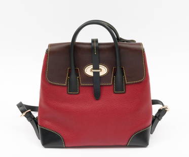 Dooney & Bourke Miranda Backpack: Red Verona pebbled leather, brown leather flap, and black leather accents on corners and straps. Double top handles, adjustable backpack straps. Tab closure, goldtone hardware. Red-lined interior. Com