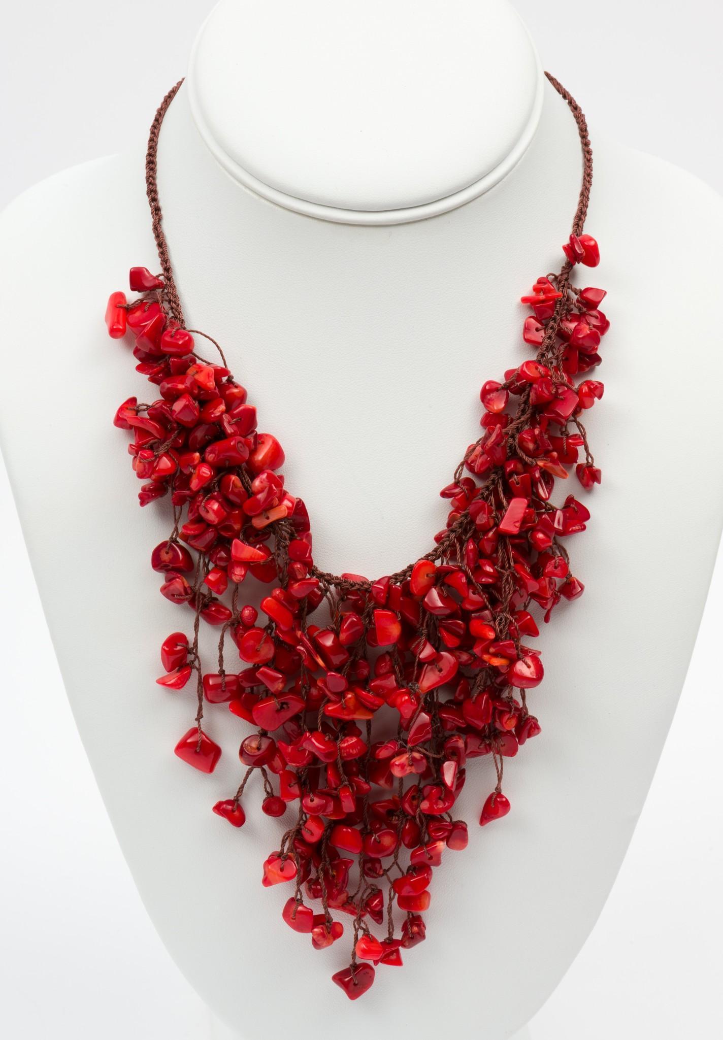 Faux Coral Statement Necklace: 14" long with 3-1/2" long strands of beads. On knotted silk cord. MH/EK IMPORTANT: Before bidding, please read the terms and conditions. When you registered for the auction you agreed to these terms a