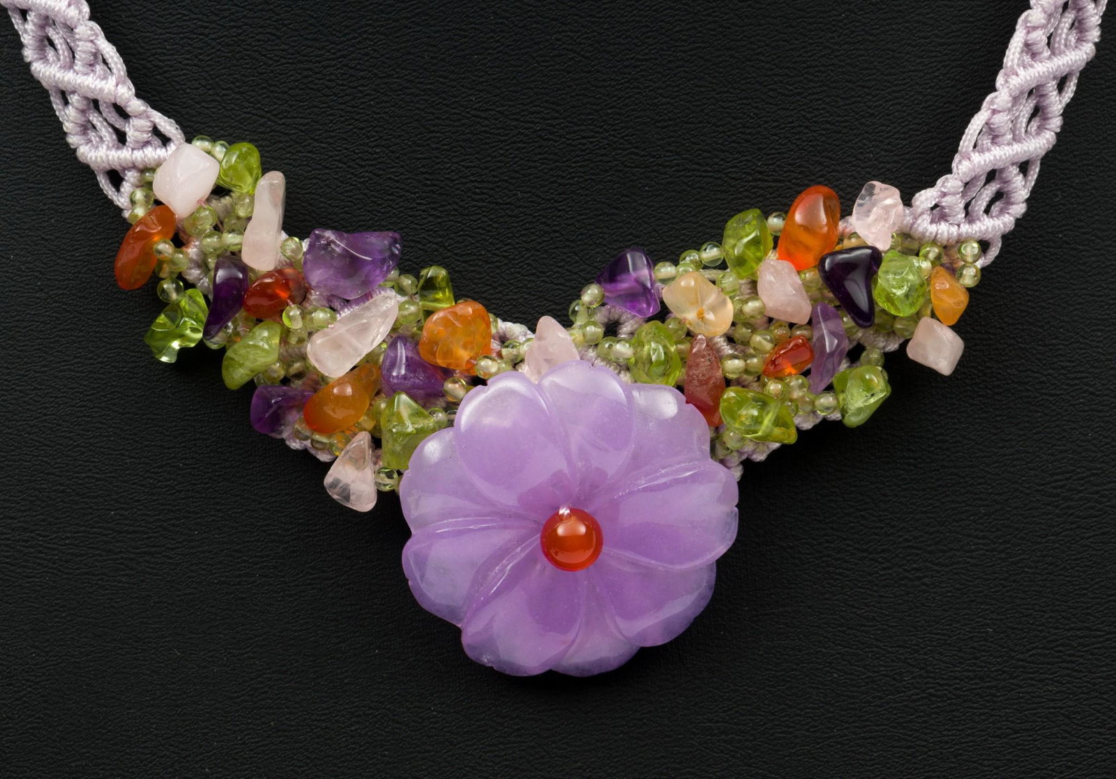 Hardstone Floral Necklace: Carved amethyst flower with amethyst, peridot, carnelian accents. On knotted silk necklace. 22" long with 1-1/8" diameter flower. MH. IMPORTANT: Before bidding, please read the terms and conditions. W