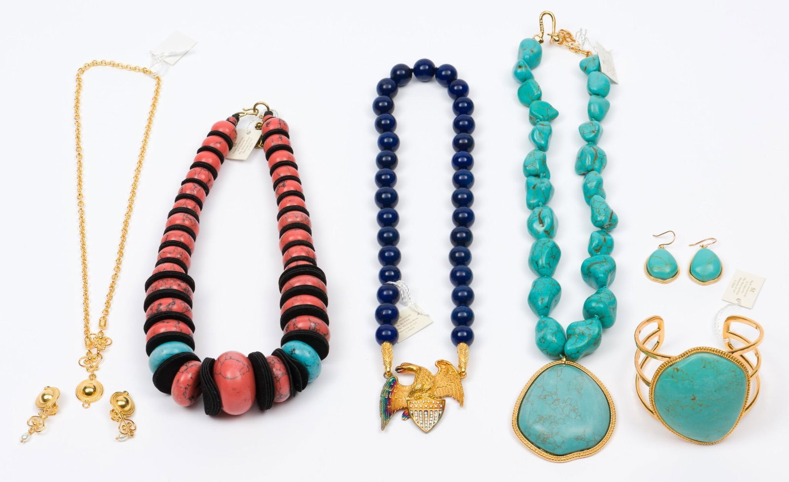 Metropolitan Museum of Art jewelry: Tibetan pendant necklace 18" long, cuff bracelet, and earrings 1-1/4" long. American eagle necklace 16" long. Roman dome necklace and earrings. Coral and turquoise necklace 16" long. All in original b