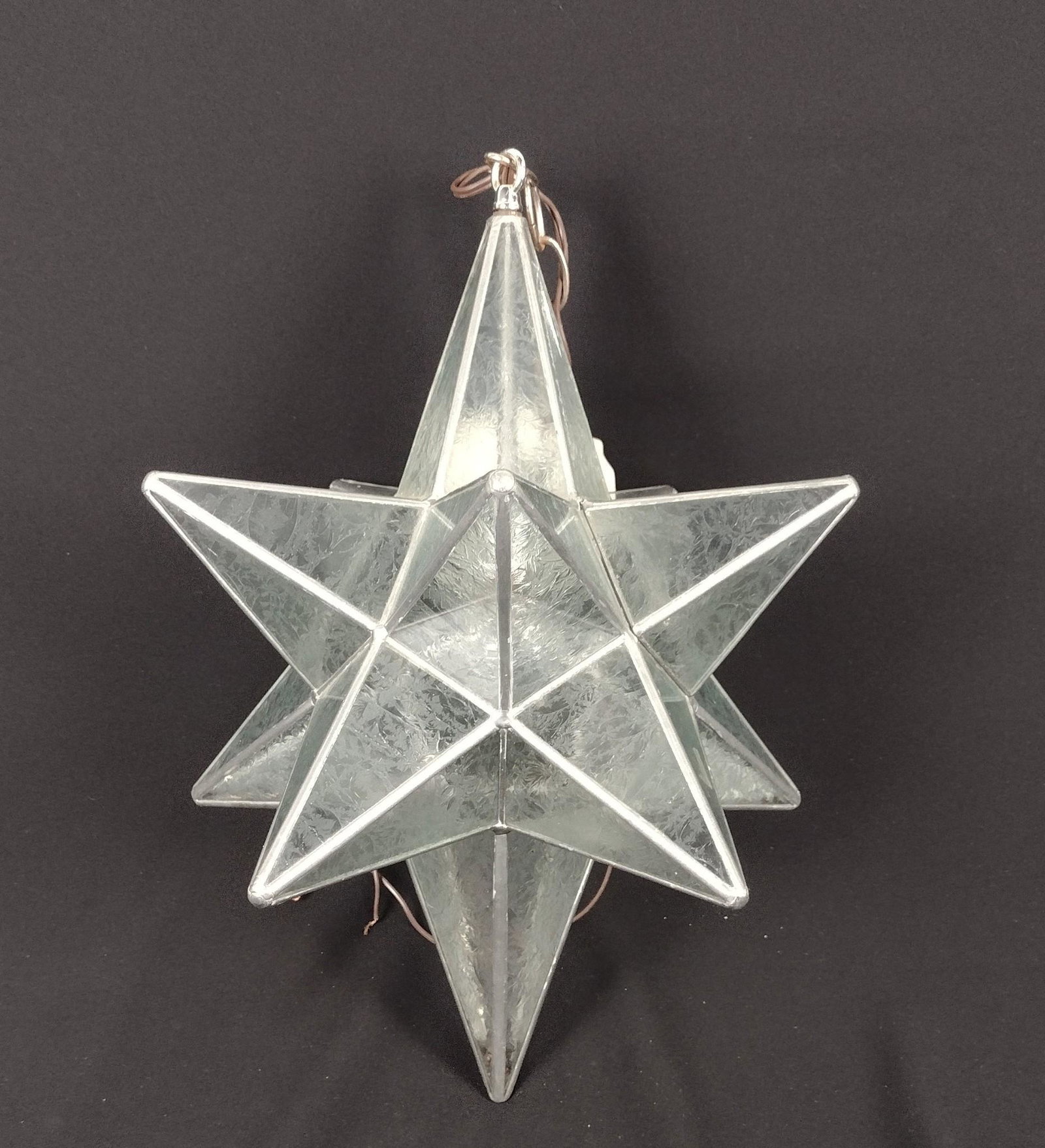 Artist Signed Stained Glass Moravian Star: Signed "Angela Earle Bethlehem, PA." 12-3/4" wide X 17-3/4" high. MEG IMPORTANT: Before bidding, please read the terms and conditions. When you registered for the auction you agreed to these terms and