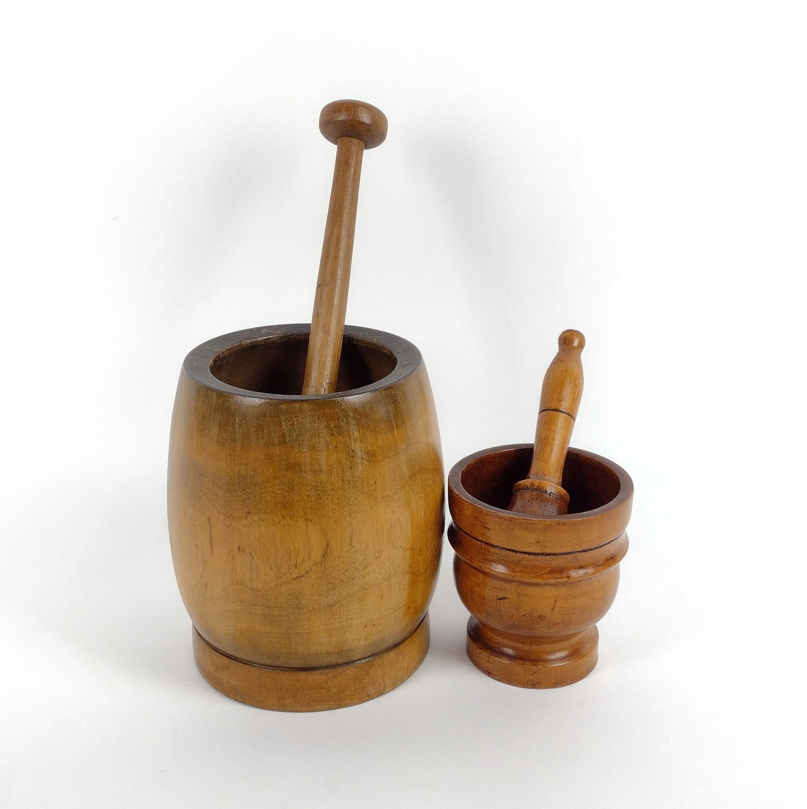 2 Wooden Mortar & Pestles: 4-1/4" to 5-1/2" wide X 4-3/4" to 7-1/2" high. MEG IMPORTANT: Before bidding, please read the terms and conditions. When you registered for the auction you agreed to these terms and will be required t