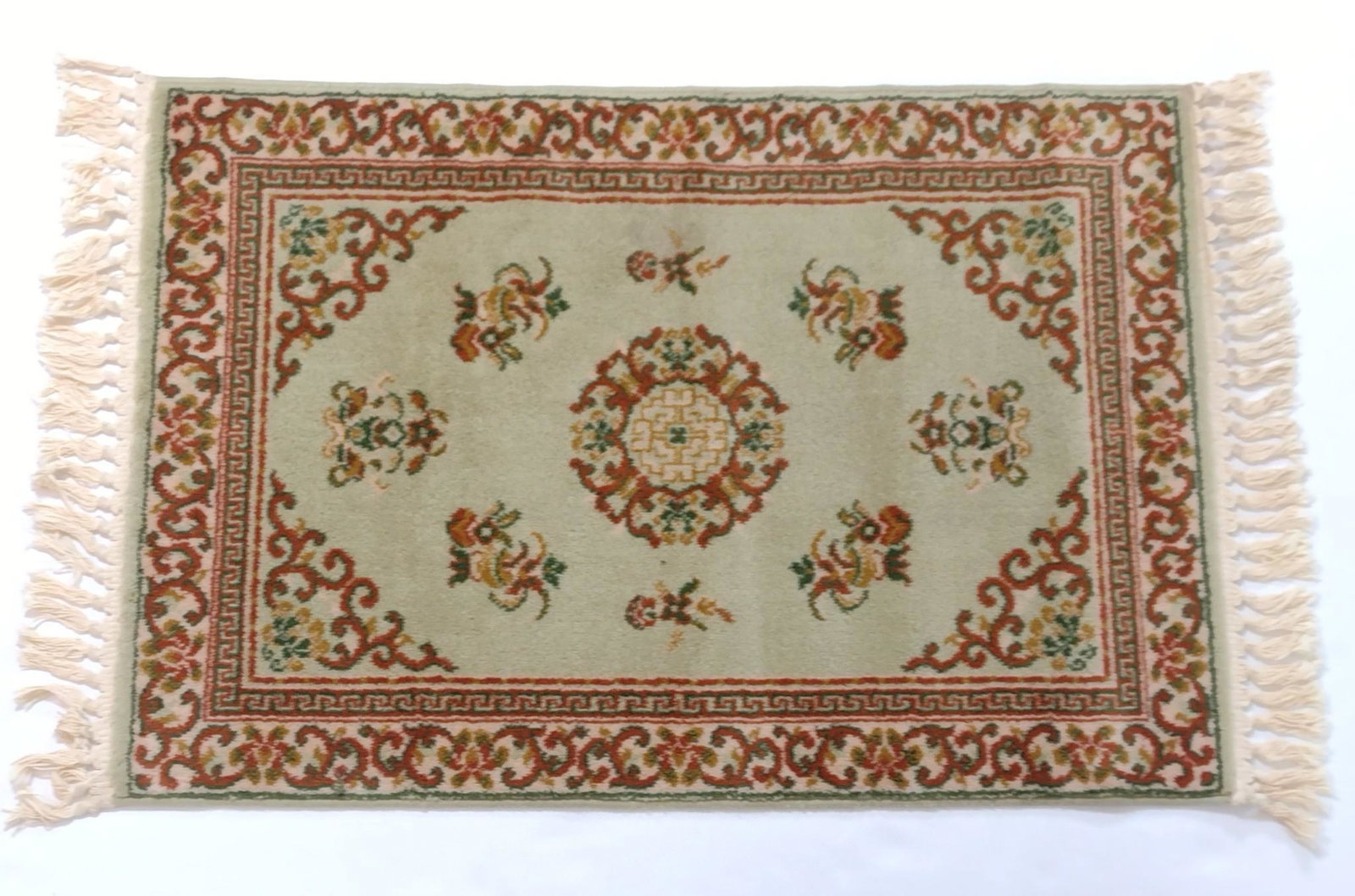 Wool Area Rug: Distributed by JC Penny. 5'5" long X 2'8" wide. MG. IMPORTANT: Before bidding, please read the terms and conditions. When you registered for the auction you agreed to these terms and will be required 
