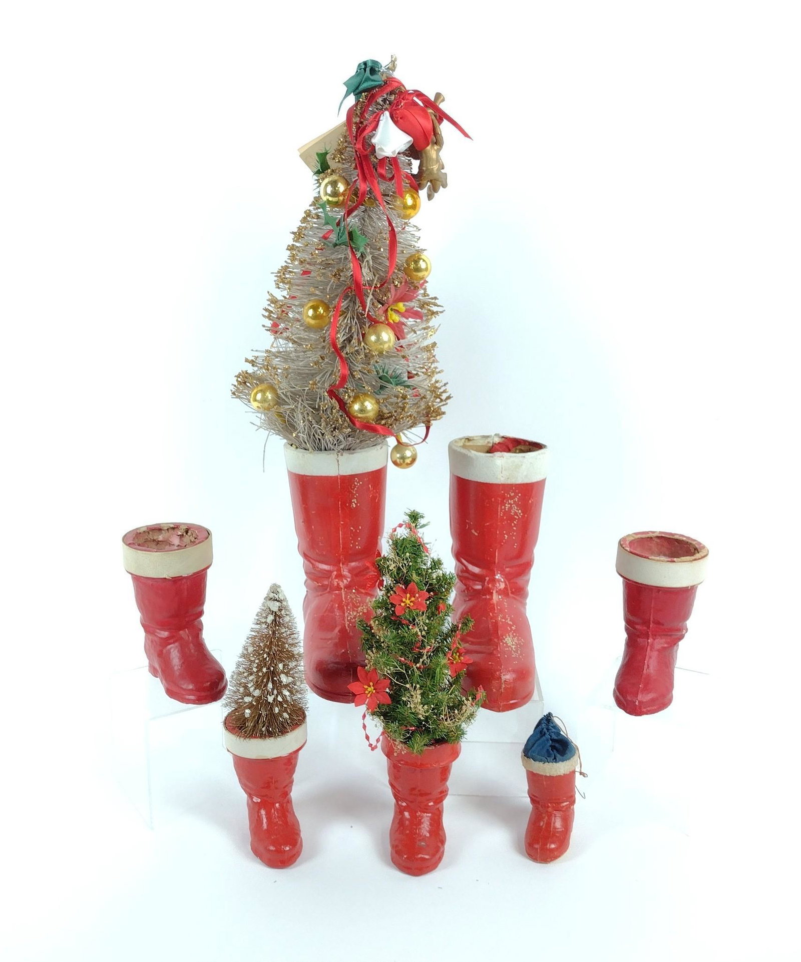 7 Antique Paper Mache Boots incl Tree: 4" to 20" high. Some cracks and paint loss. MEG IMPORTANT: Before bidding, please read the terms and conditions. When you registered for the auction you agreed to these terms and will be required to c