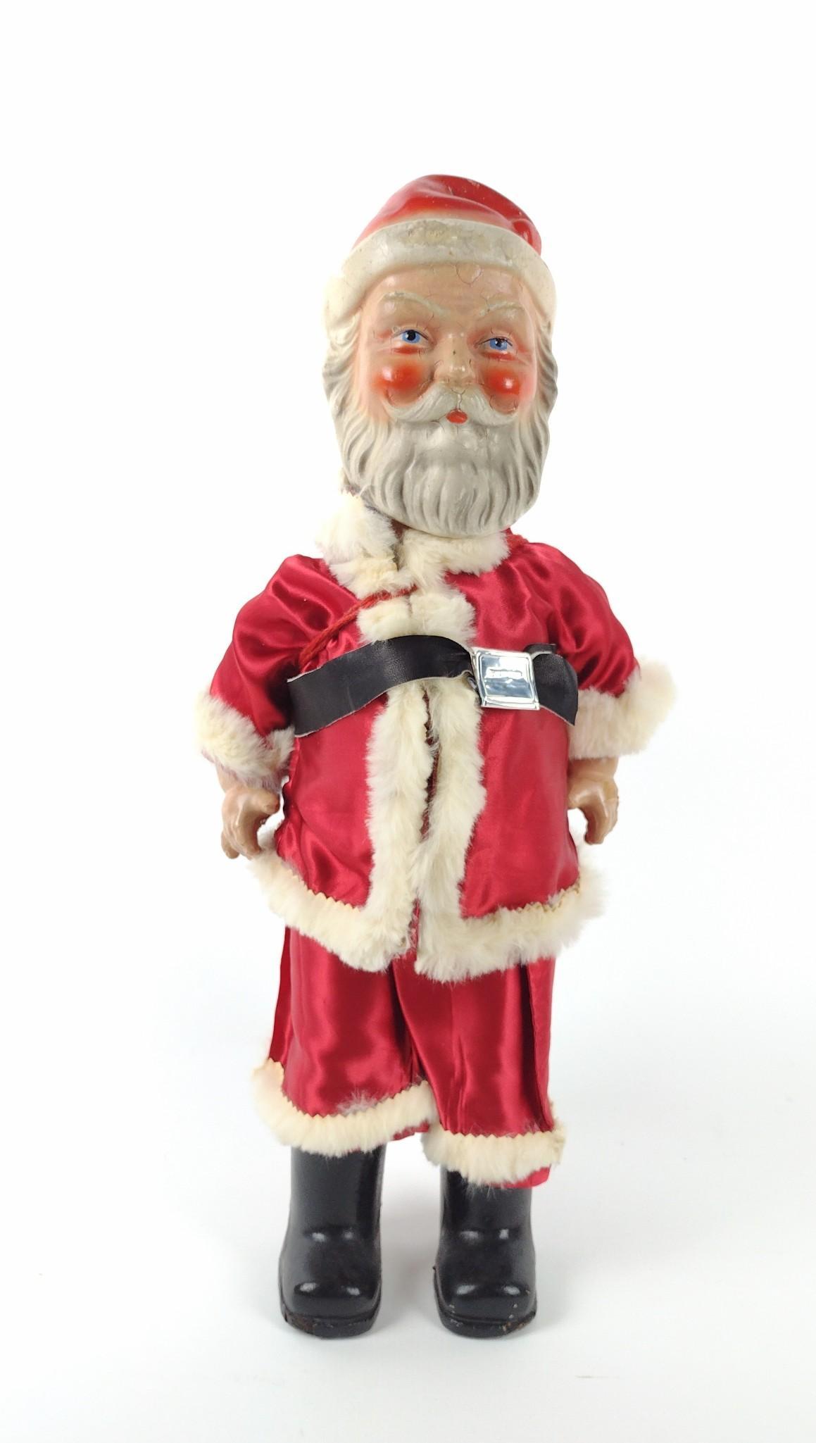 Antique Papier Mache Santa: Rope strung. 7-1/2" wide x 7" deep x 19" high. Some cracks and finish loss. RM IMPORTANT: Before bidding, please read the terms and conditions. When you registered for the auction you agreed to these
