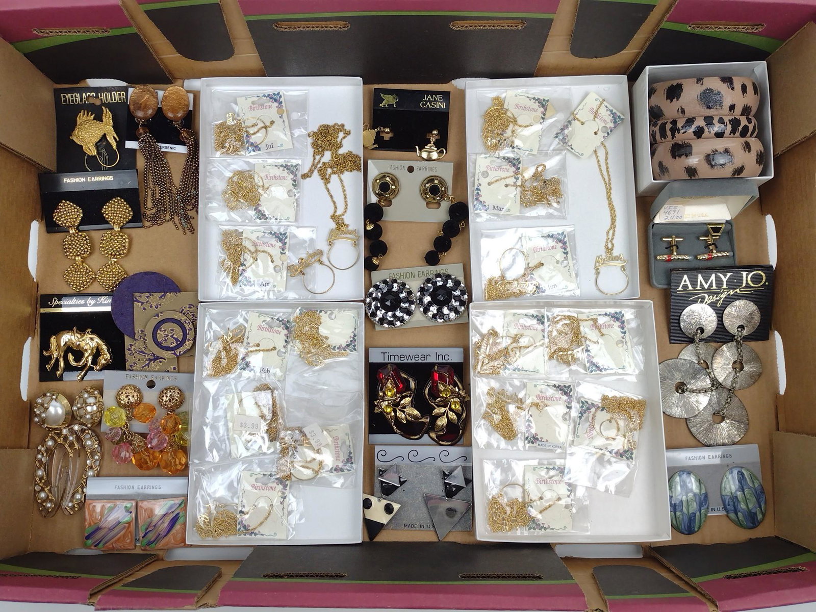 Lot Of Costume Jewelry: Includes Ear Rings, birthstone Necklaces, Bangle Bracelets, and more. MG. IMPORTANT: Before bidding, please read the terms and conditions. When you registered for the auction you agreed to these terms