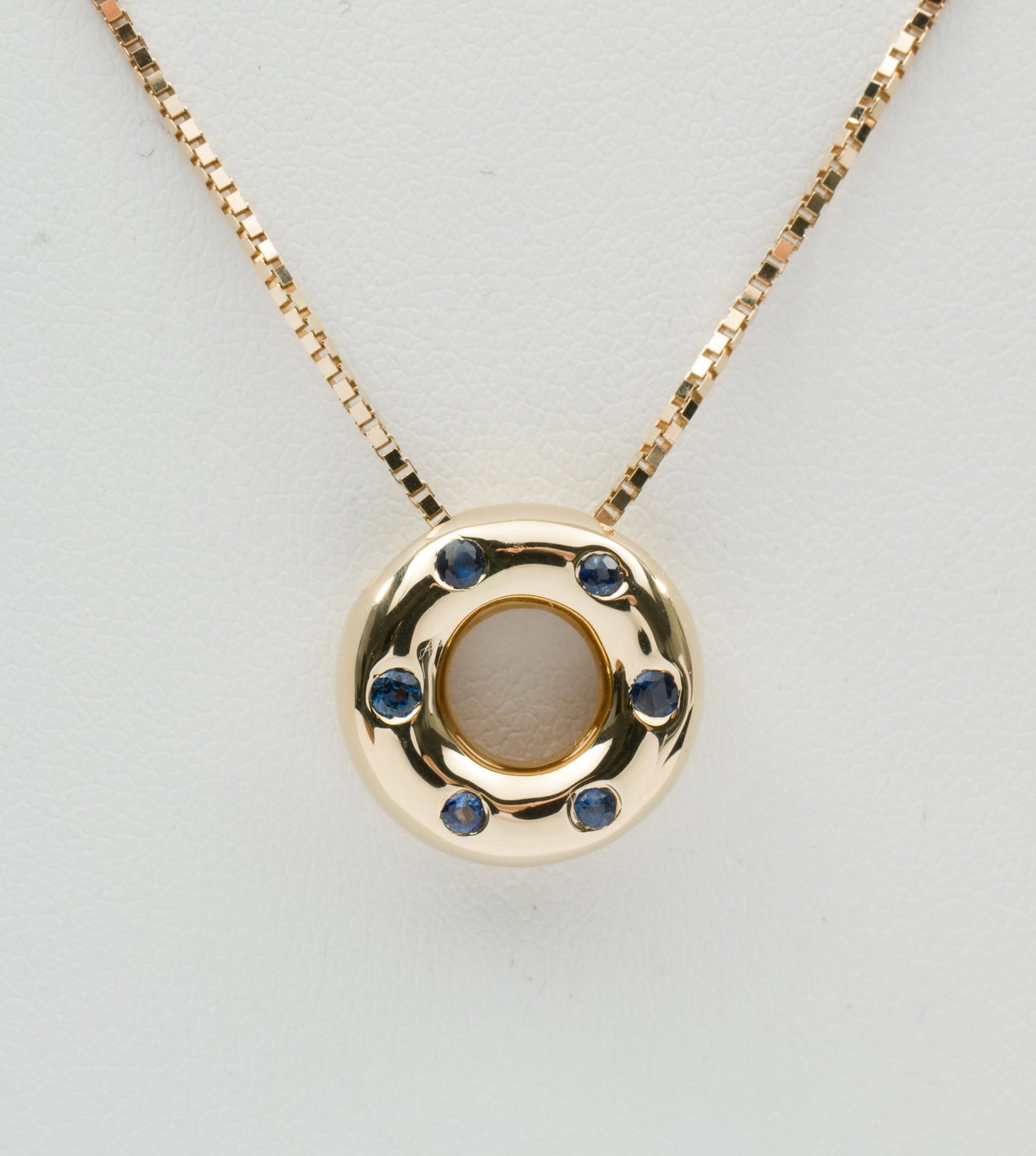Bailey, Banks & Biddle 14K Gold & Sapphire Pendant Necklace: DESCRIPTION: 14k (stamped) gold pendant flush mounted with six round cut blue sapphires. Also stamped for maker with lower case "m" in circle. On 14k gold chain. Includes Bailey, Banks & Biddle neckla