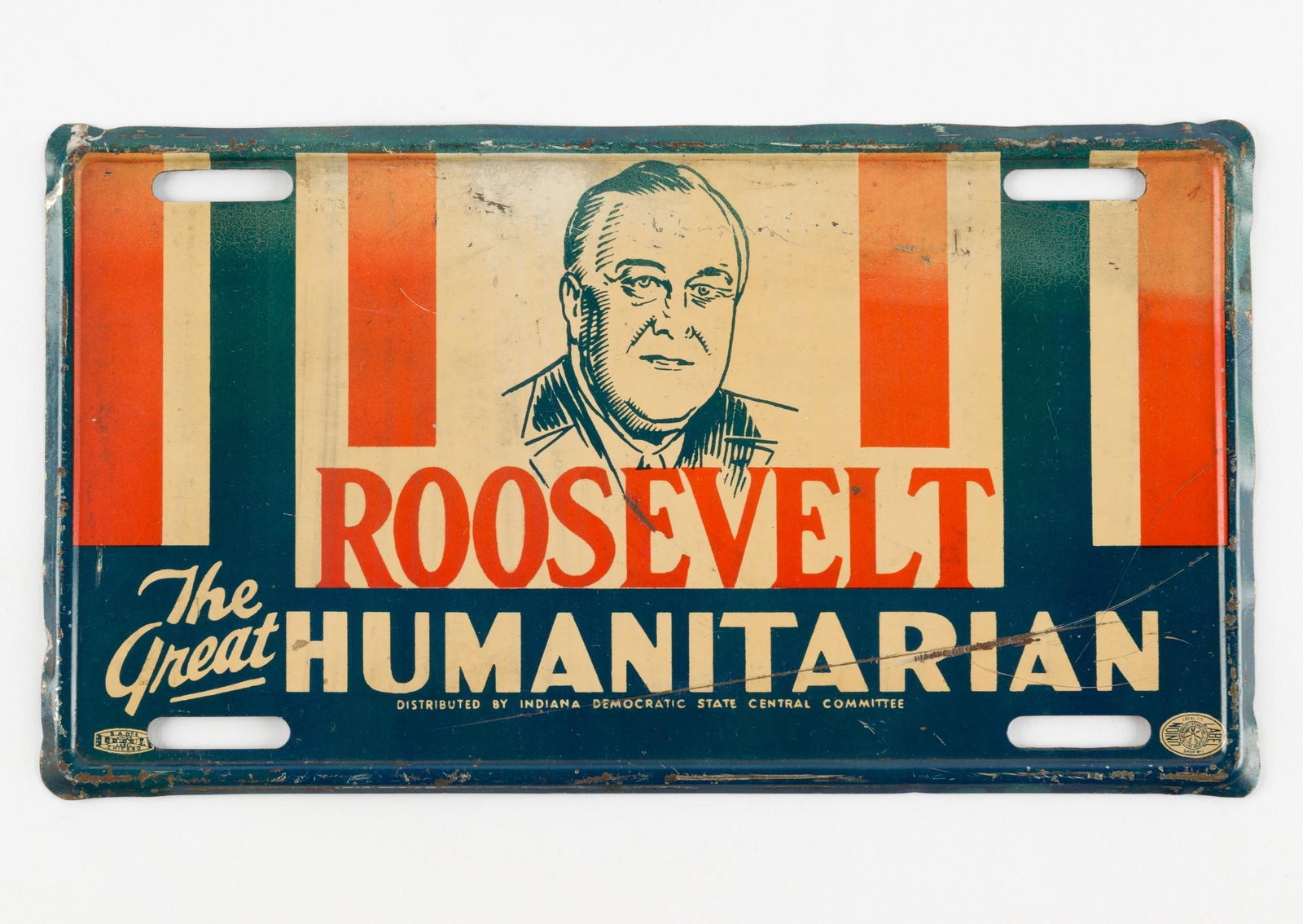 Roosevelt Humanitarian License Plate Topper: Reads "Roosevelt The Great Humanitarian". Distributed by Indiana Democratic State Central Committee. Union labels to both bottom corners. 9-1/2" wide x 5-1/2" high. Overall wear including large scratc