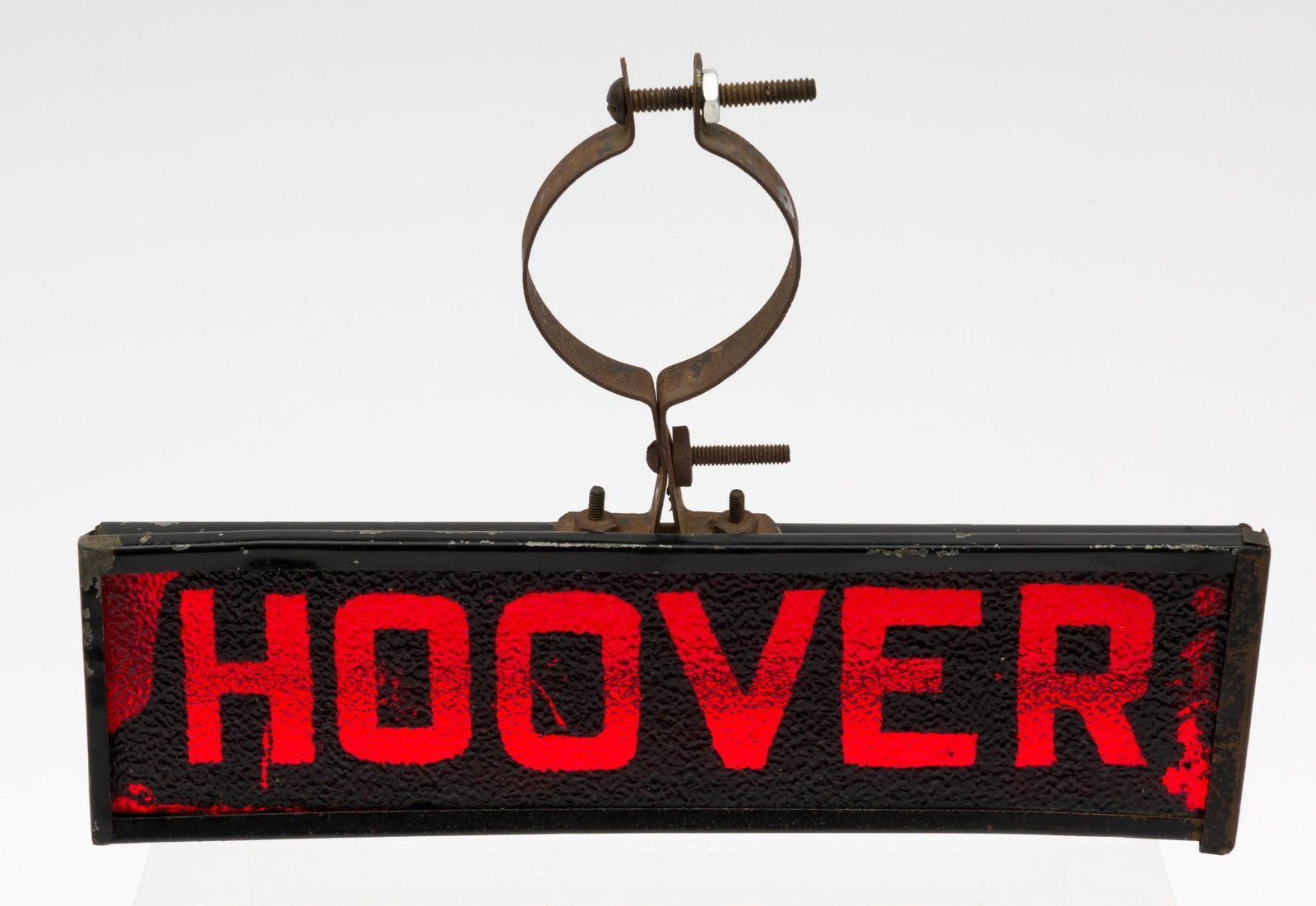 "Hoover" Reflective Auto Attachment: "Hoover" reflective auto attachment, circa 1928. Open base allows light to reflect off interior mirror and illuminate the glass "Hoover" panel. Tall mounting bracket to top. 2-3/4" high x 3" deep x 9-
