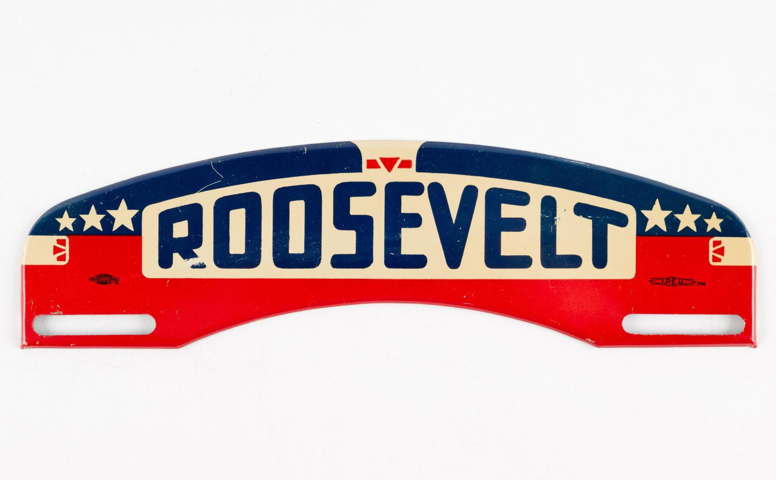 Roosevelt License Plate Topper: Illegible manufacture mark to left side. Marked I.P.E.U. 288 to right. 10-1/8" wide x 2-3/4" high. Minor scuffs and paint wear. RM IMPORTANT: Before bidding, please read the terms and conditions. When