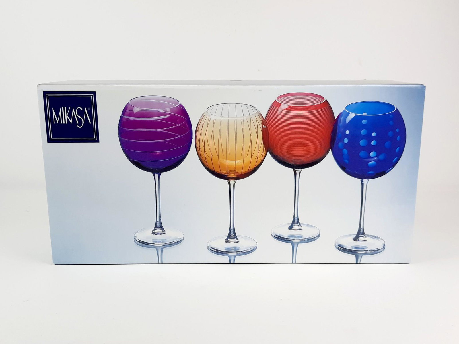 4 Mikasa Wine Glasses: Each 4-1/4" diameter x 9" high. Box with some wear. LR IMPORTANT: Before bidding, please read the terms and conditions. When you registered for the auction you agreed to these terms and will be requir