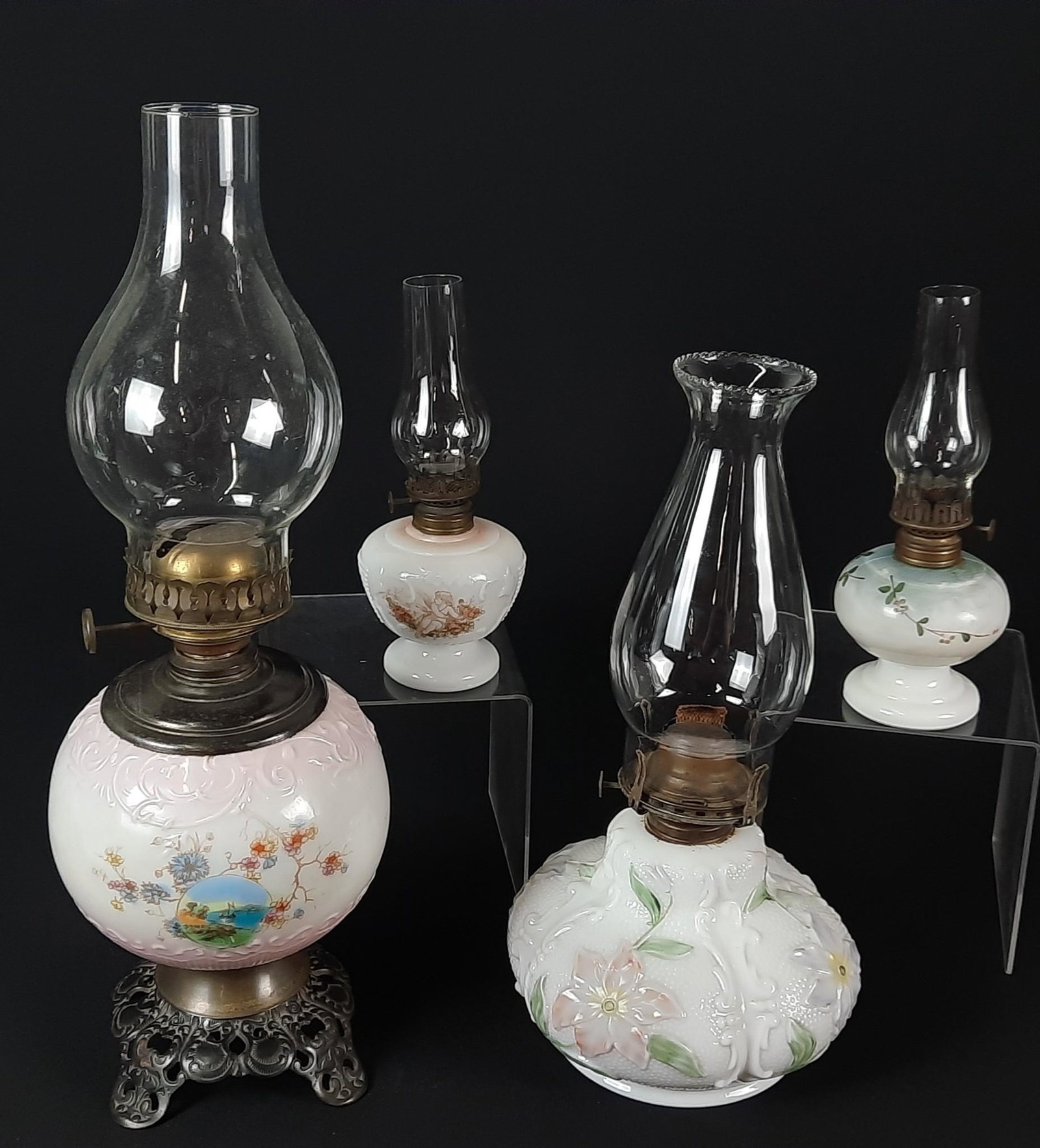 4 Painted Oil Lamps: 9" to 19-3/4" high. LR IMPORTANT: Before bidding, please read the terms and conditions. When you registered for the auction you agreed to these terms and will be required to comply with them.
