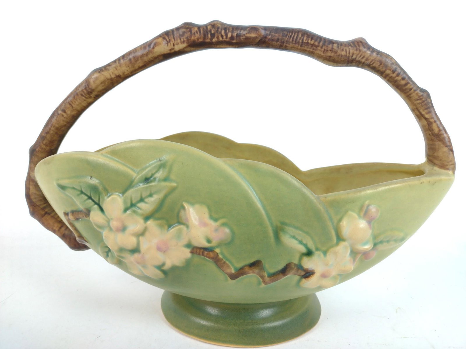 8" Roseville Apple Blossom Basket: Number 310-10. 11" wide x 8" high. JB IMPORTANT: Before bidding, please read the terms and conditions. When you registered for the auction you agreed to these terms and will be required to comply with