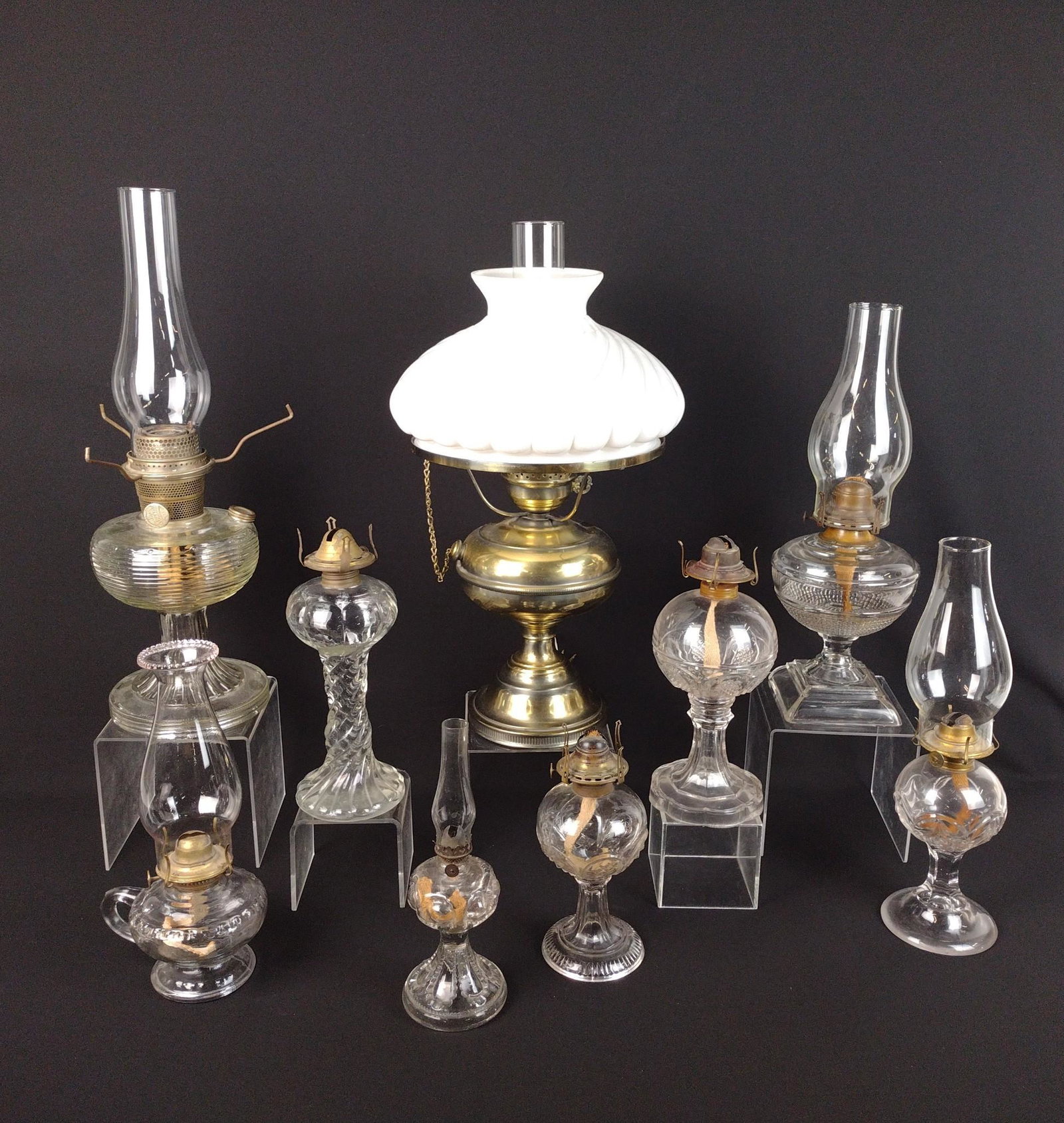 9 Oil Lamps: 10-1/2" - 20-1/4" high. RM IMPORTANT: Before bidding, please read the terms and conditions. When you registered for the auction you agreed to these terms and will be required to comply with them.
