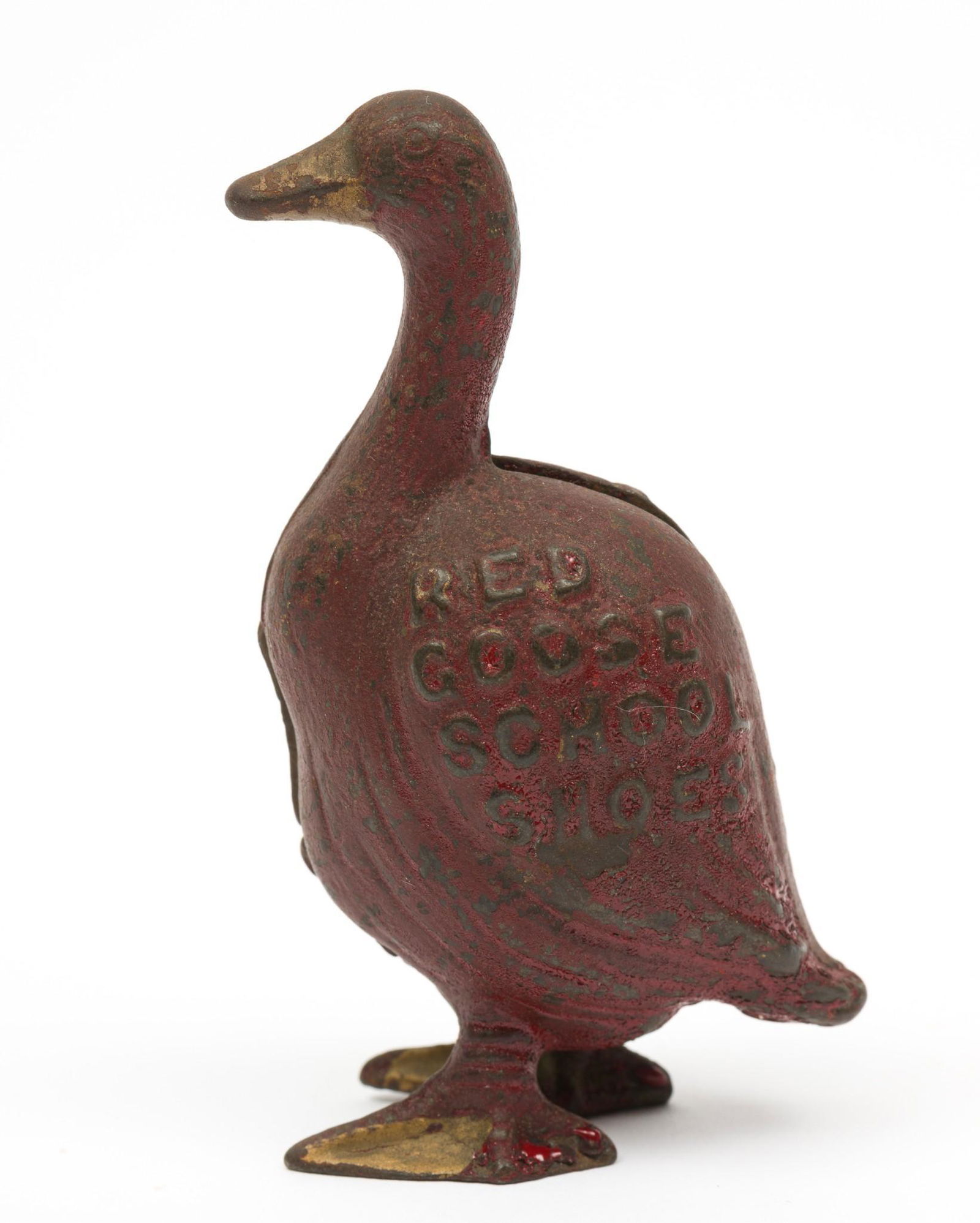 Red Goose School Shoes Still Bank: By Arcade, 1920s. Most of red paint still intact, slightly faded. 3-7/8" high x 2-1/2" wide. RM IMPORTANT: Before bidding, please read the terms and conditions. When you registered for the auction you