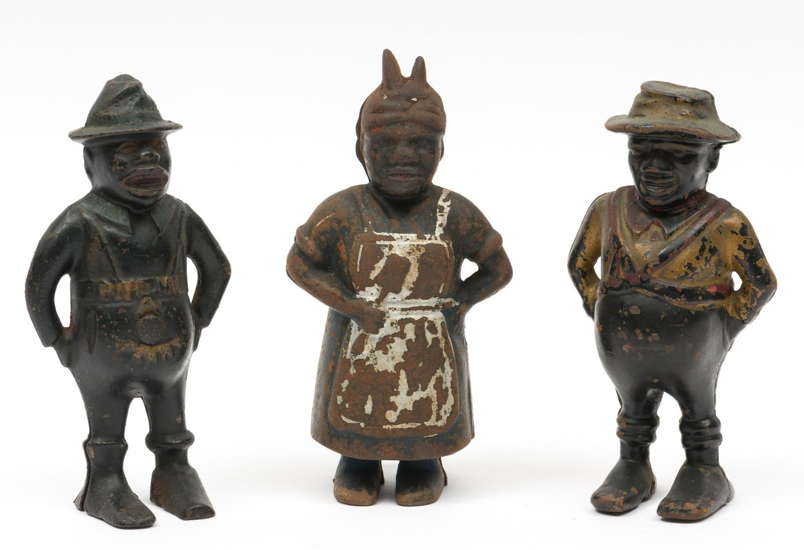 3 Black Americana Still Banks: Includes Wing "Give Me A Penny" c.1894, Aunt Jemima (Mammy with Spoon) by A.C. Williams 1905-1930s, and Darkey (Sharecropper) by A.c. Williams c. 1901. All with paint wear and corrosion. 2-7/8" wide -