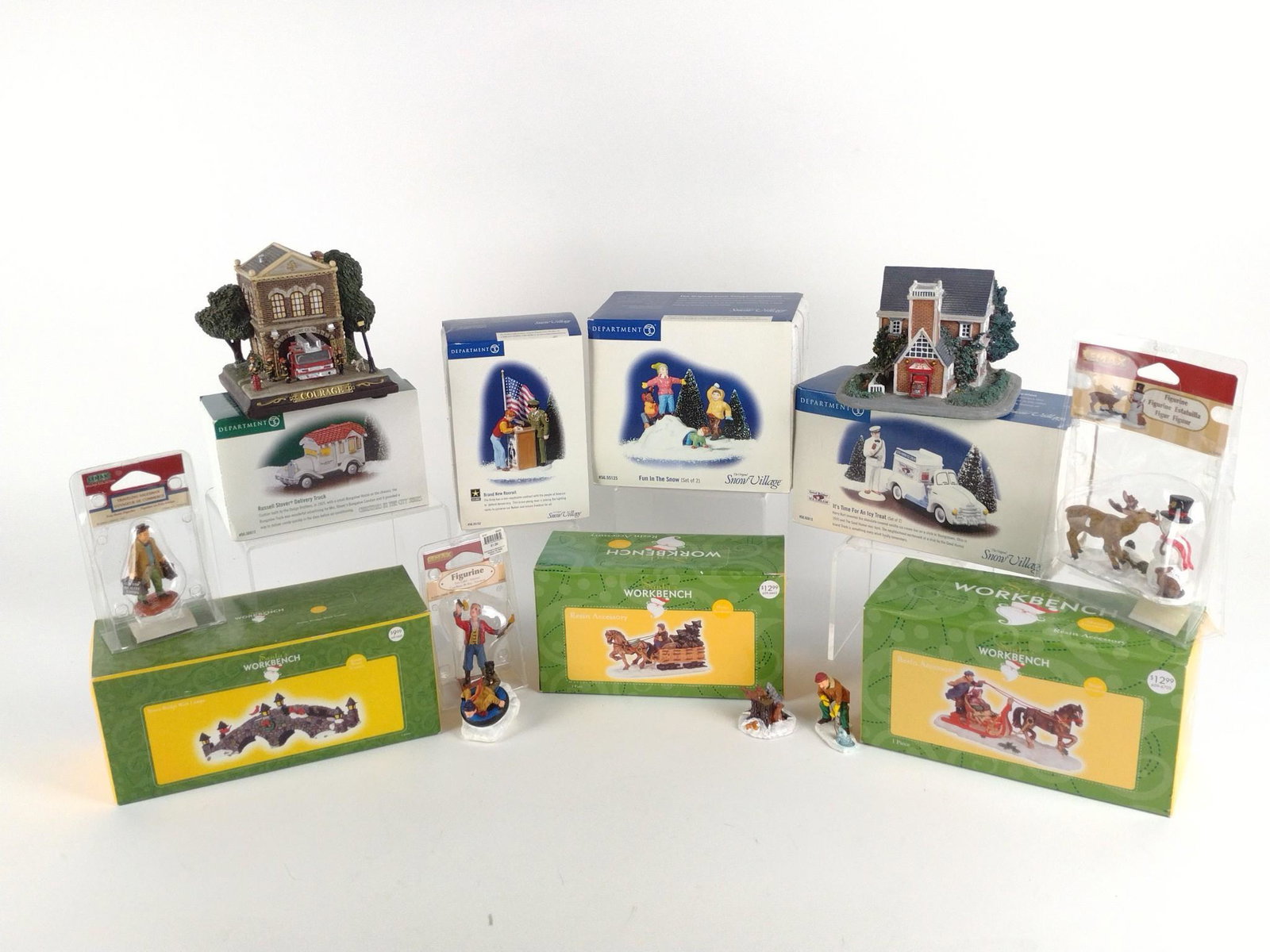Christmas Village Figurines and Houses Incl Dept. 56: Includes Department 56 Snow Village Brand New Recruit, Fun in the Snow, It's Time for an Icy Treat, and Christmas in the City Russell Stover Delivery Truck. Also includes three Jo-Ann Stores Santa's W