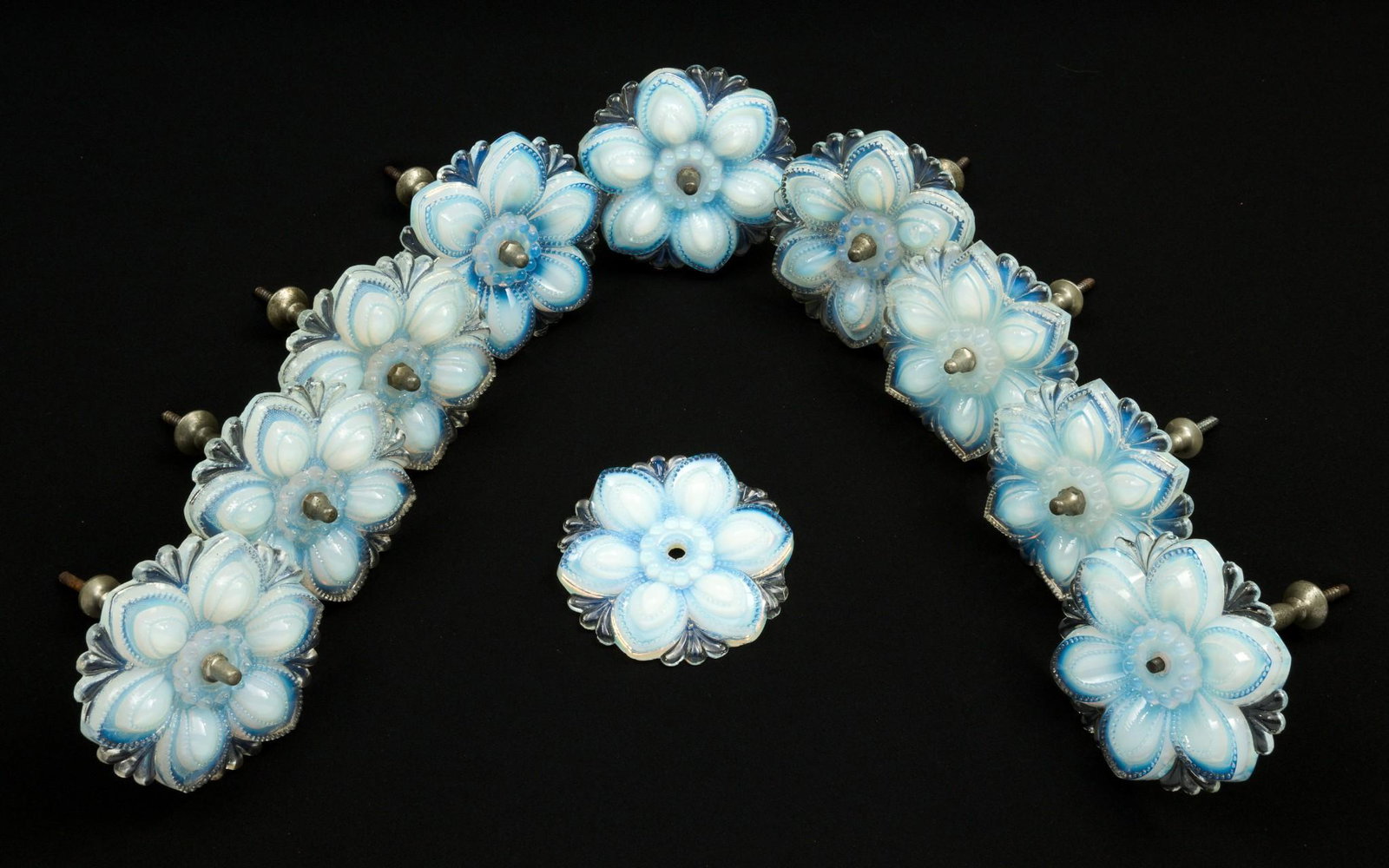 10 Opaline Glass Flower Curtain Tiebacks: DESCRIPTION: Ten opaline glass flower curtain tiebacks, 19th century. With nine wall anchors. MEASUREMENTS: 4-1/2" diameter. Anchors 5-3/4" long. CONDITION: One anchor missing nut. DP. IMPORTANT: Befo